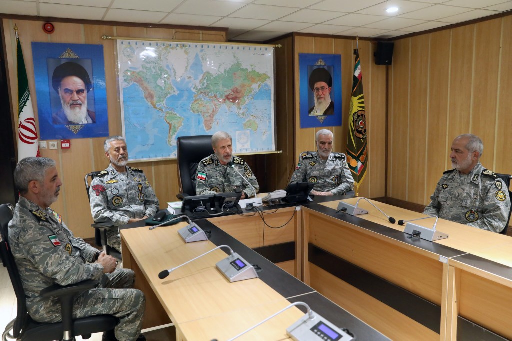the Iranian Army media office on June 23, 2025, shows the Army commander-in-chief Amir Hatami (C) speaking during a meeting in the Iranian Army's War Command Room.