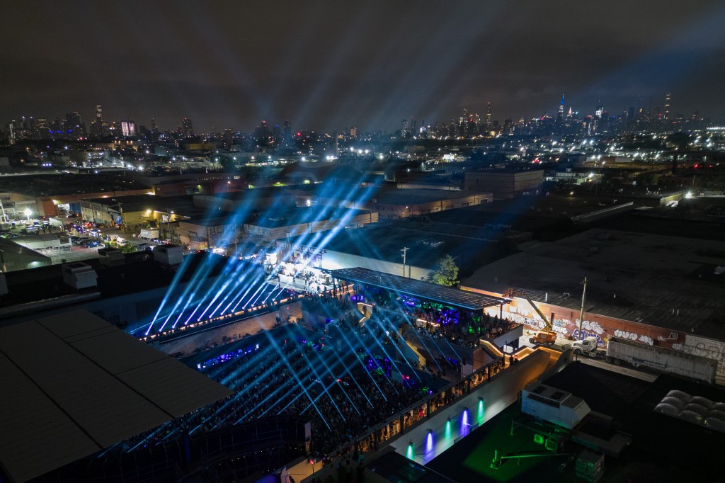 Aerial view of The Brooklyn Mirage at night with a concert in progress.