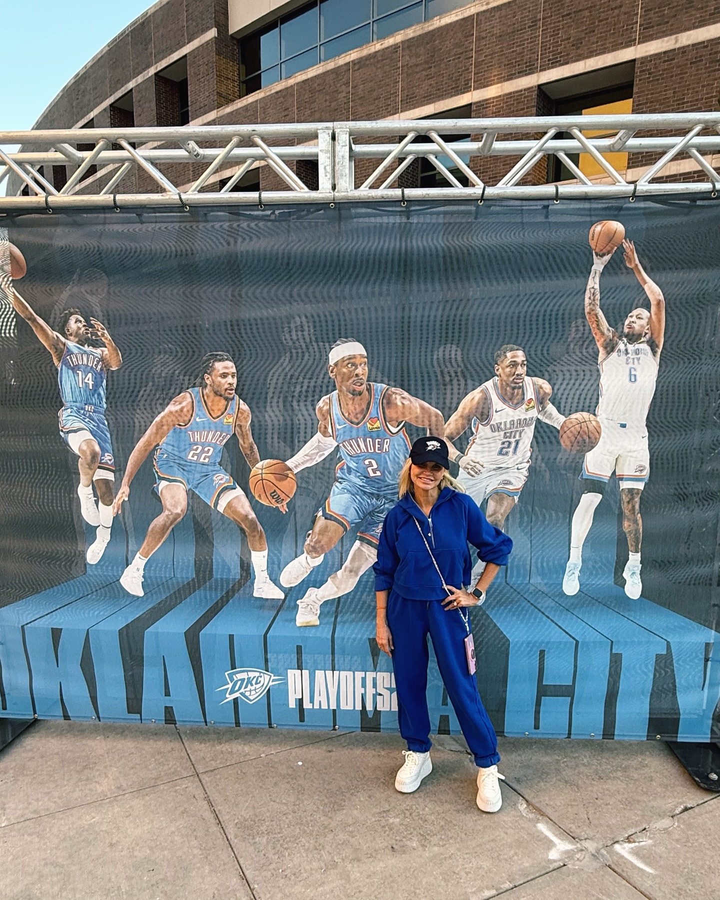 Kristin Chenoweth posing in front of an OKC Thunder mural