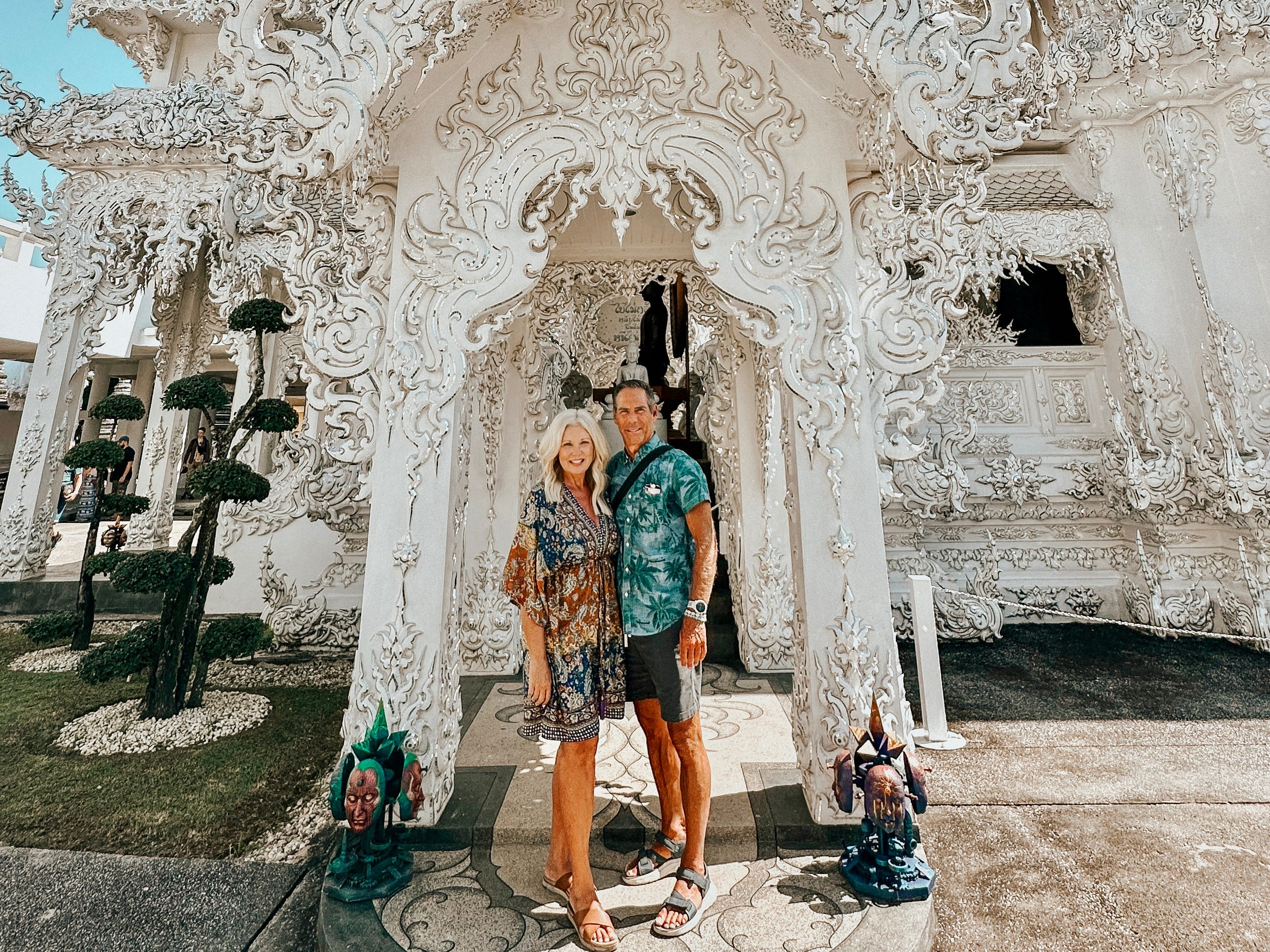 The author and her husband in front of an ornate white building.