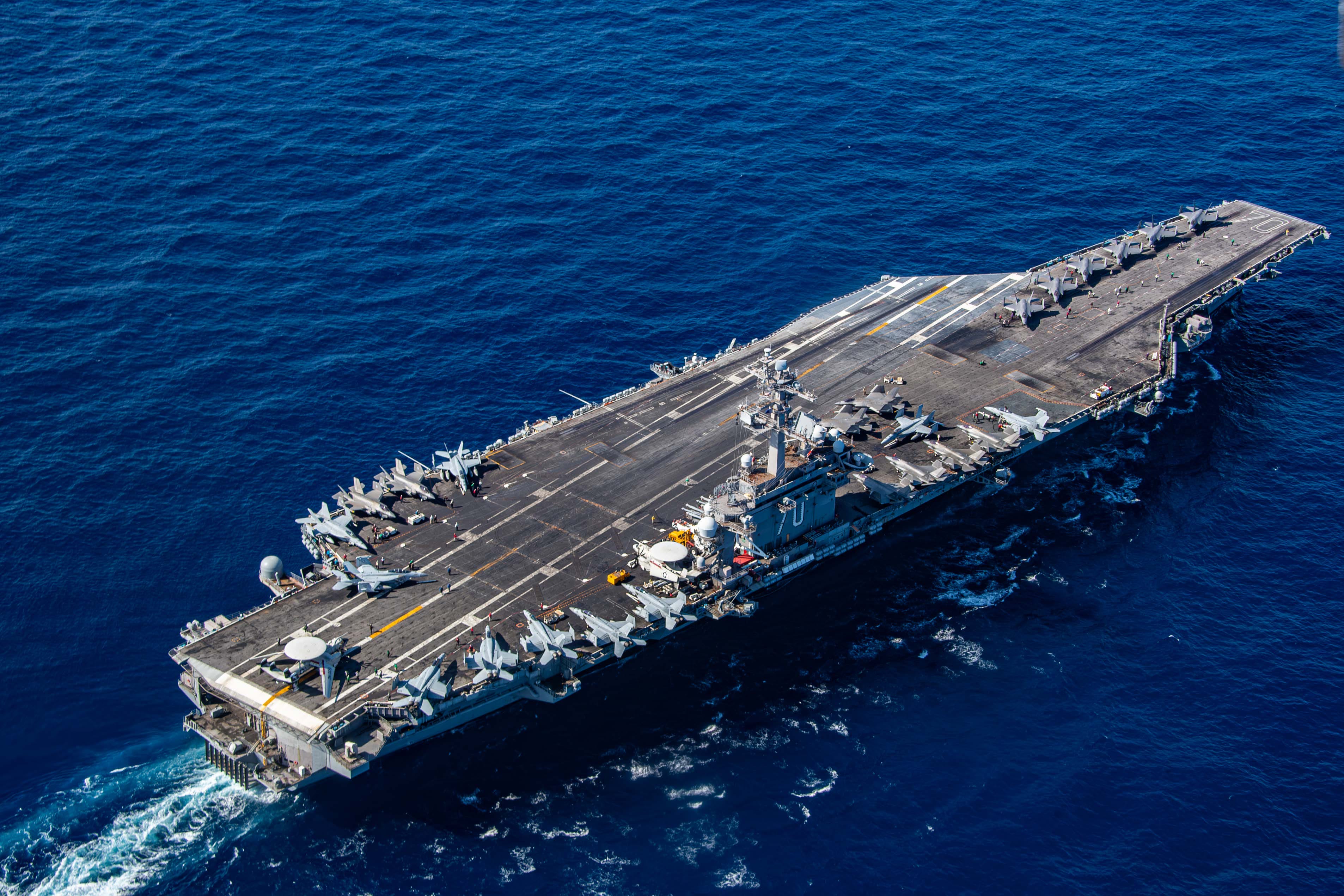 The Nimitz-class aircraft carrier USS Carl Vinson (CVN 70) transits the Philippine Sea with six additional F-35C Lightning II aircraft assigned to the "Argonauts" of Strike Fighter Squadron (VFA) 147, part of Carrier Air Wing FIVE, Dec. 13, 2024.