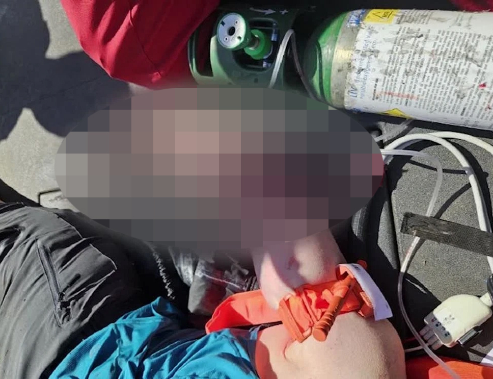 Person receiving medical attention.
