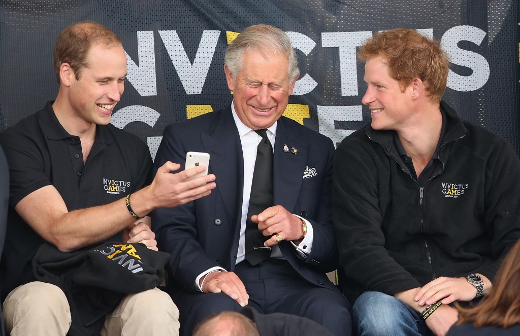 Prince Harry, Prince William and King Charles III in 2014. 