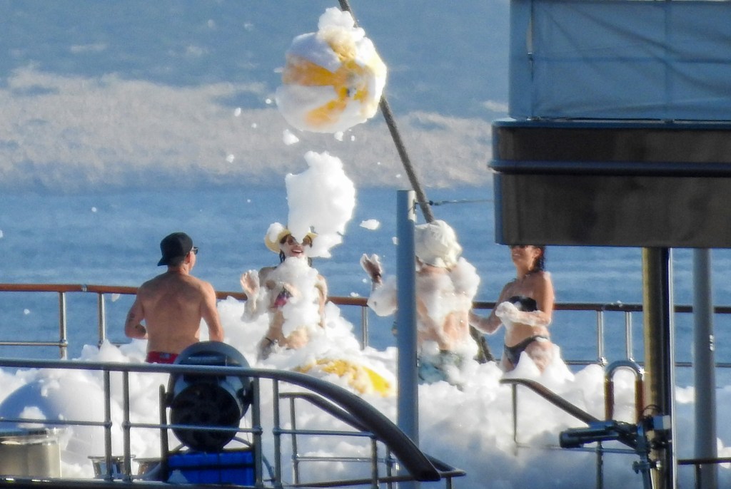 Jeff Bezos and Lauren Sánchez at a foam party on his yacht in Europe Sunday while celebrating Evan's 19th birthday. 