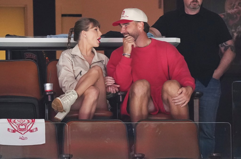 Singer Taylor Swift, left, and Kansas City Chiefs football player Travis Kelce, front right, take in the third period in Game 4 of the NHL hockey Stanley Cup Final between the Edmonton Oilers and the Florida Panthers in Sunrise, Fla., Thursday, June 12, 