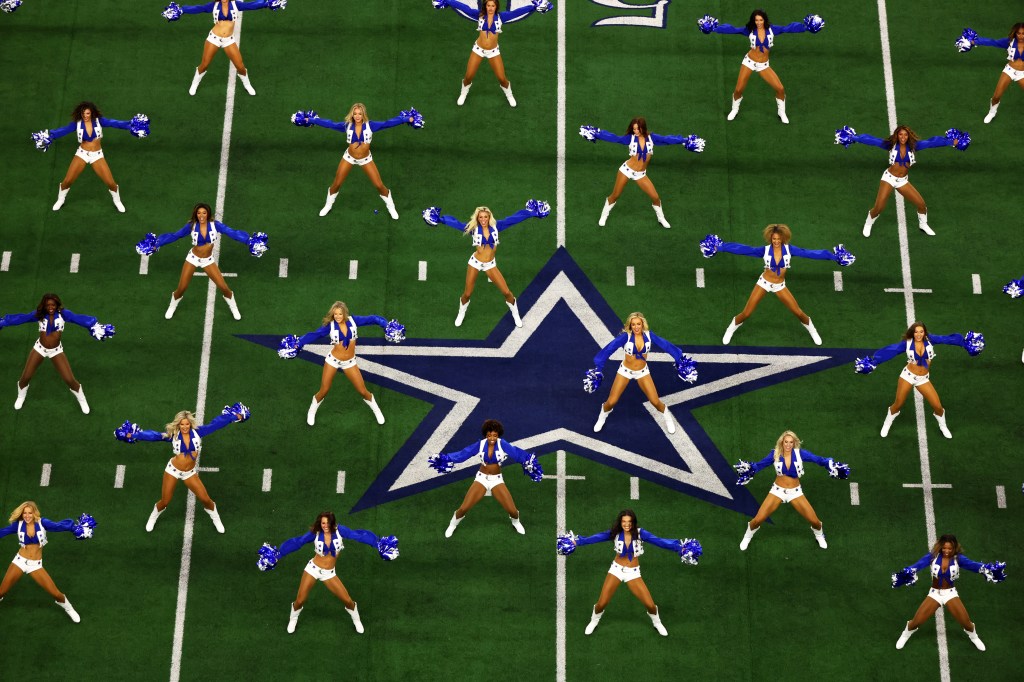 Dallas Cowboys cheerleaders perform before the game between the Dallas Cowboys and the Tampa Bay Buccaneers at AT&T Stadium on September 11, 2022 in Arlington, Texas.