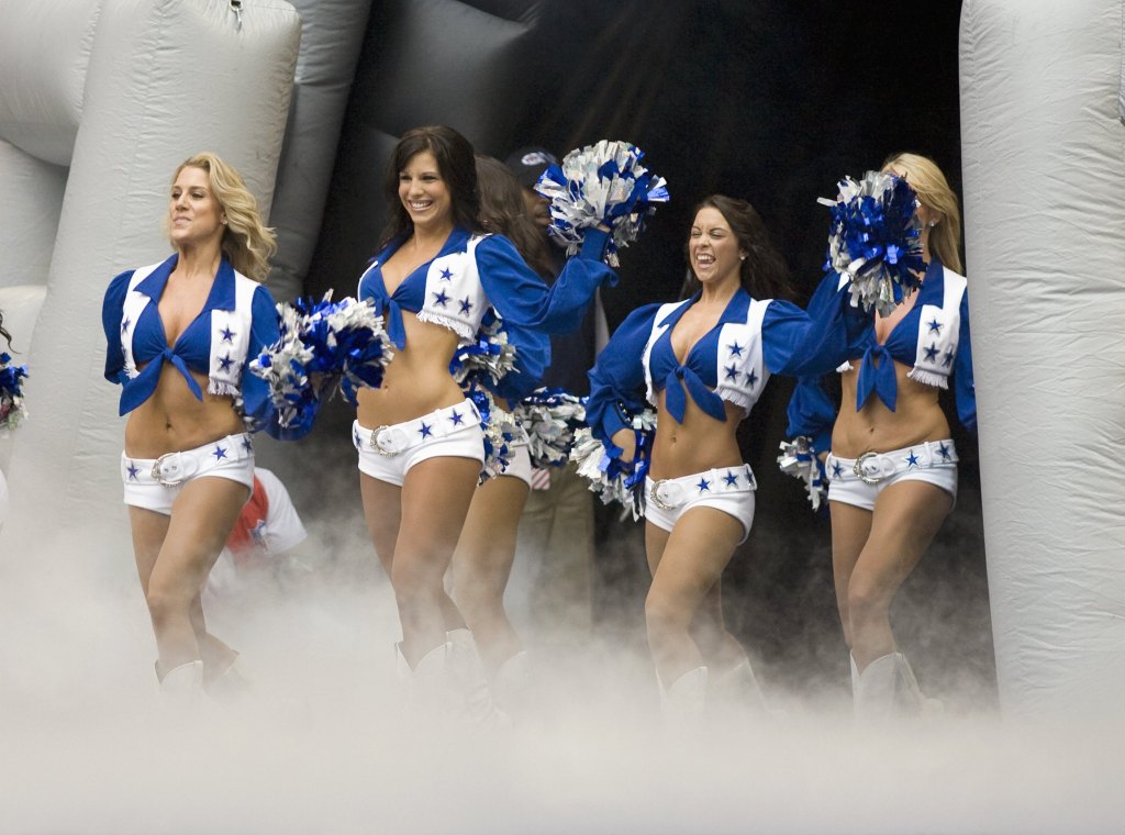 Dallas Cowboy cheerleaders perform during a preseason game against the Denver Broncos at Texas Stadium on August 18, 2007 in Irving, Texas.