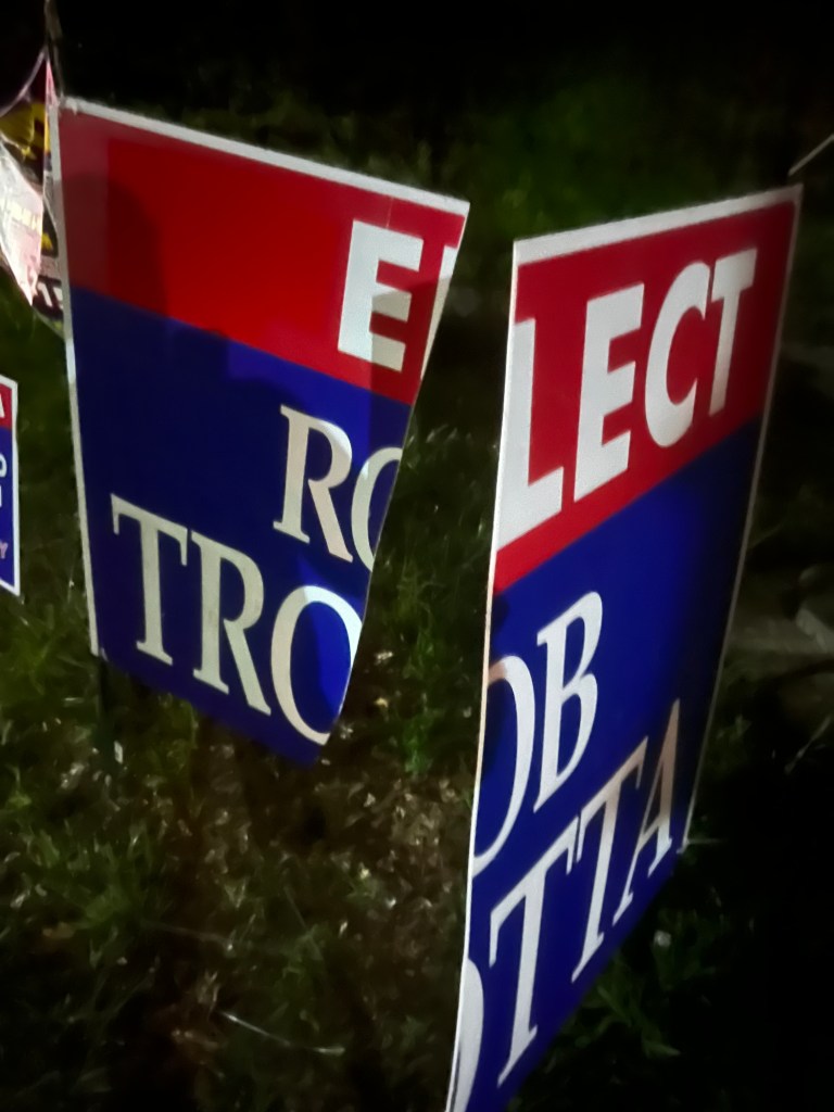 A vandalized sign for Suffolk County Legislator Rob Trotta. 