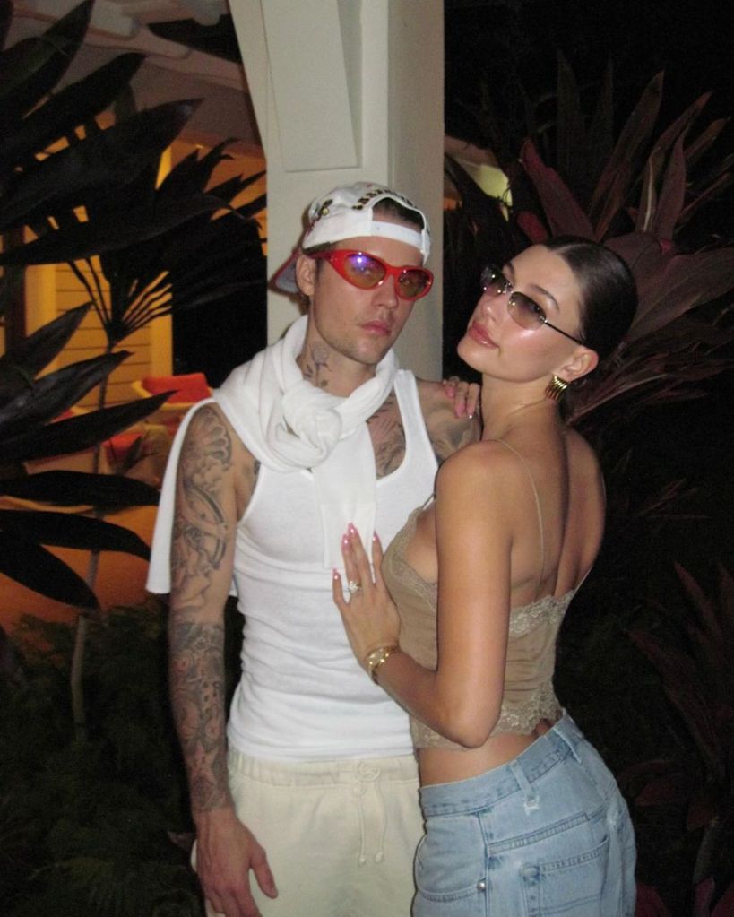 Justin and Hailey Bieber posing.