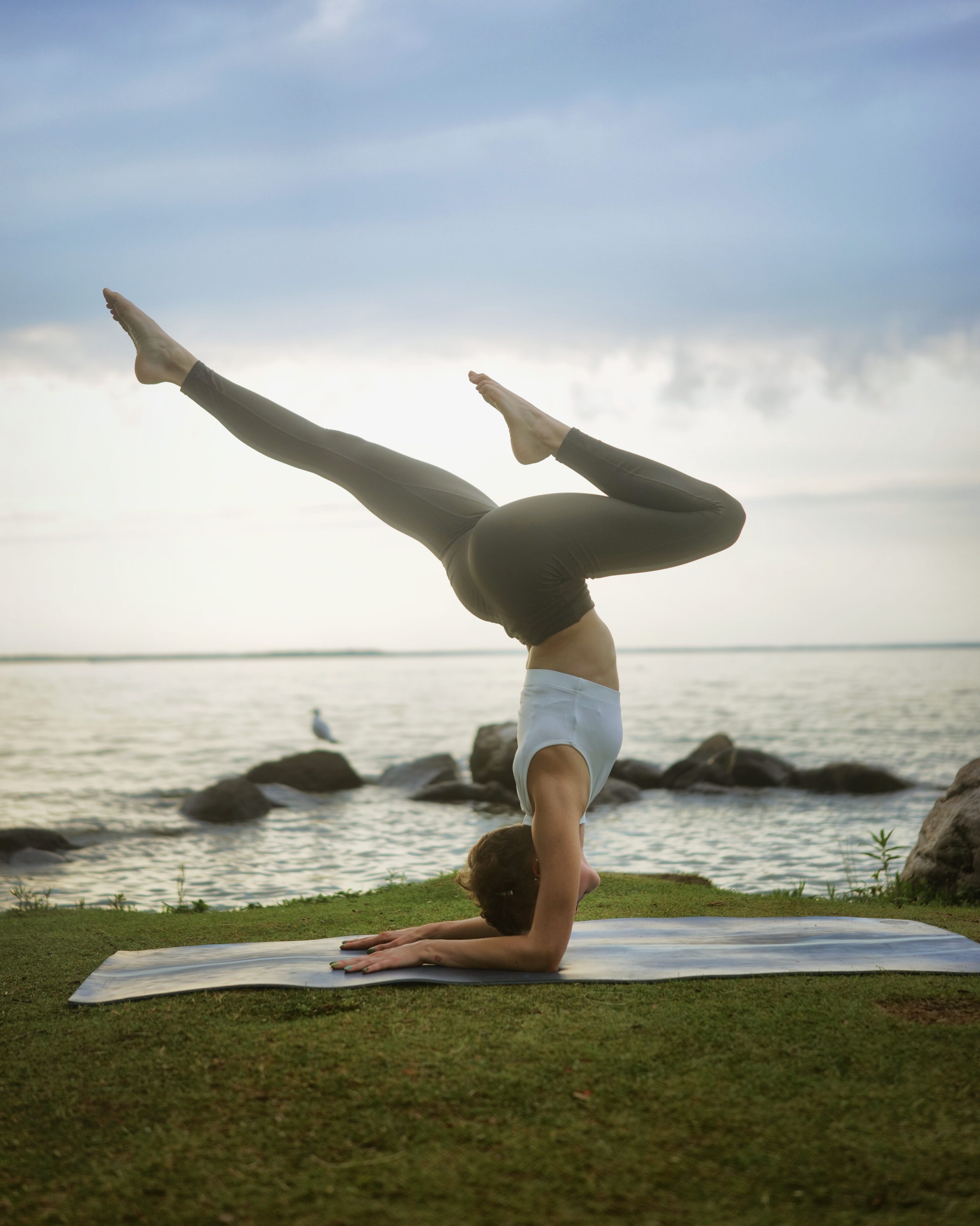 A woman doing an advanced yoga pose.