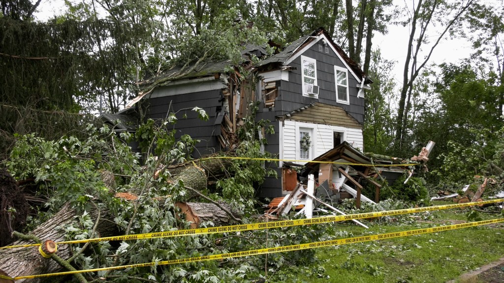 A home in Clark Mills, N.Y., that had a tree fall through it during a severe storm in the early morning, Sunday, June 22, 2025.
