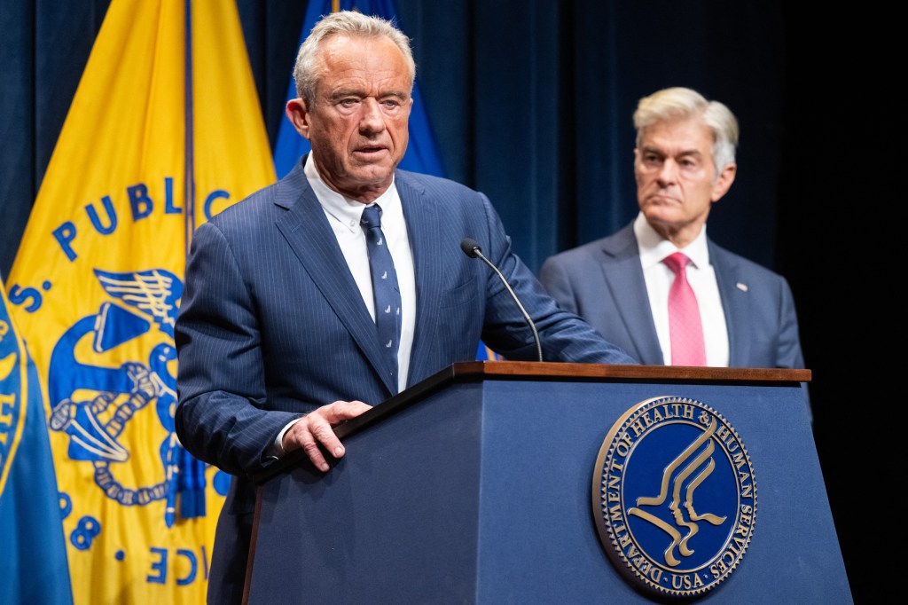 Robert F. Kennedy Jr. and Mehmet Oz at a press conference on health insurance.