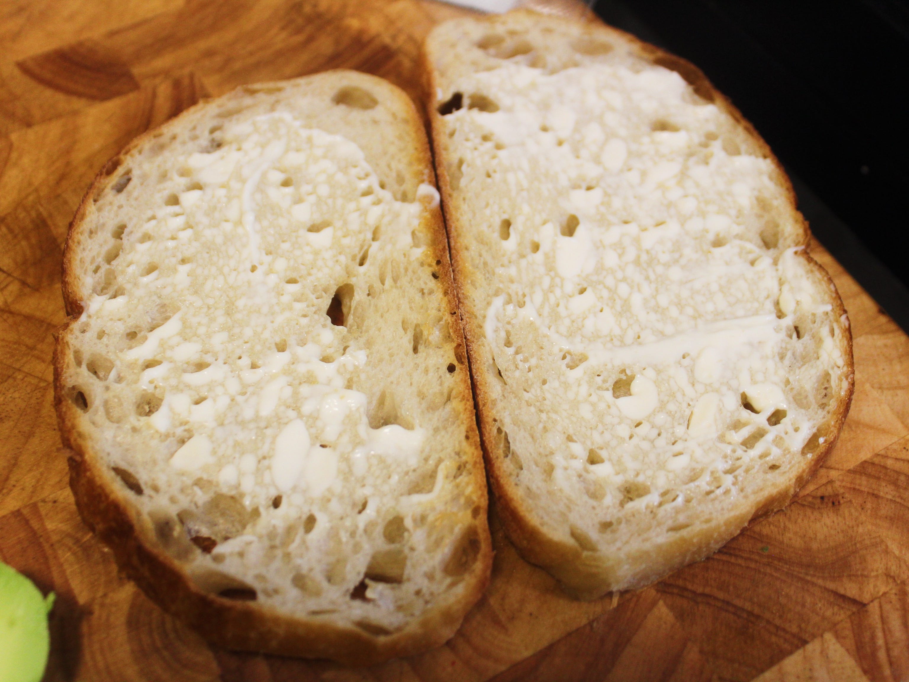 two slices of bread with mayonnaise