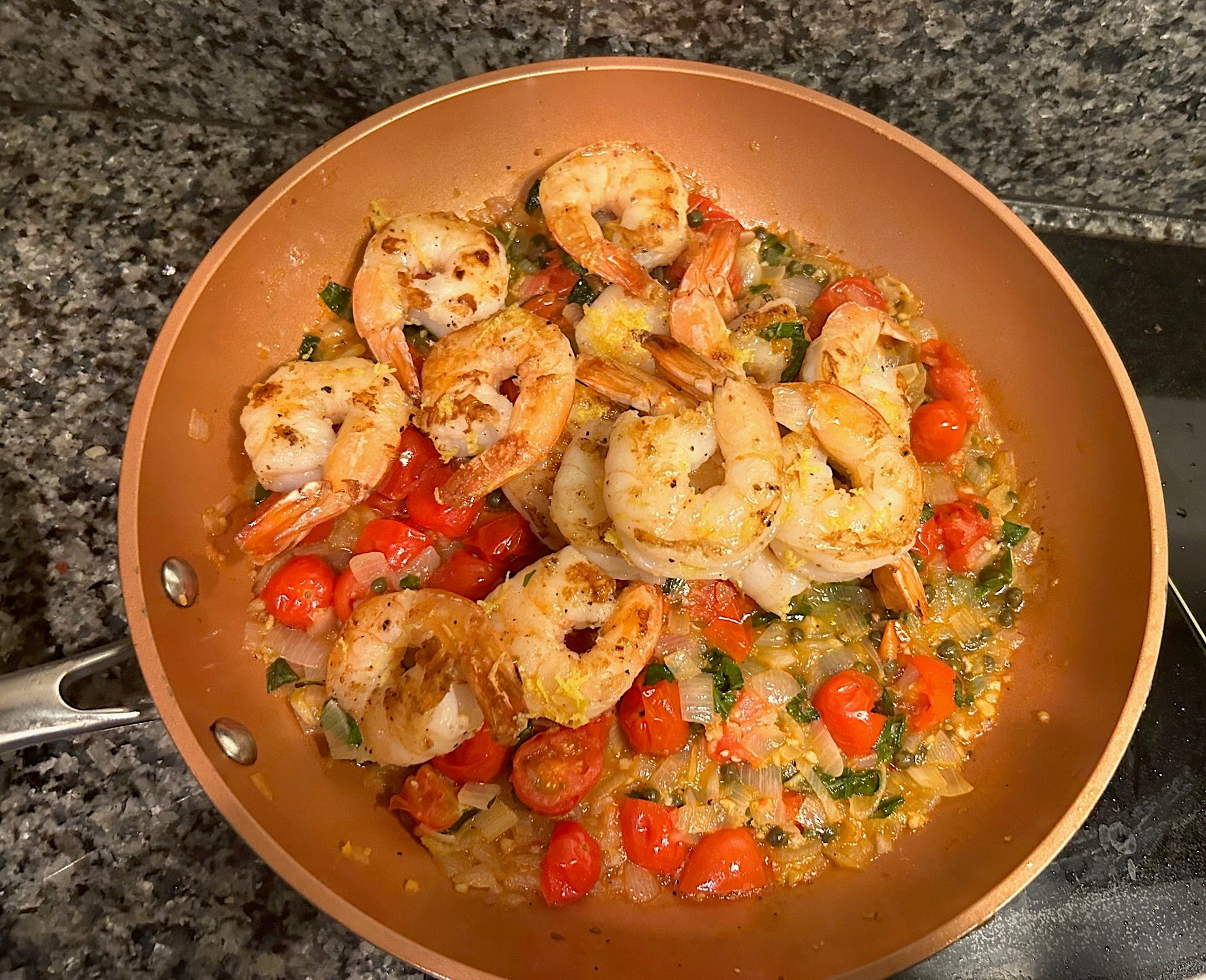 Adding shrimp to mixture for Gordon Ramsay's 10-minute scampi