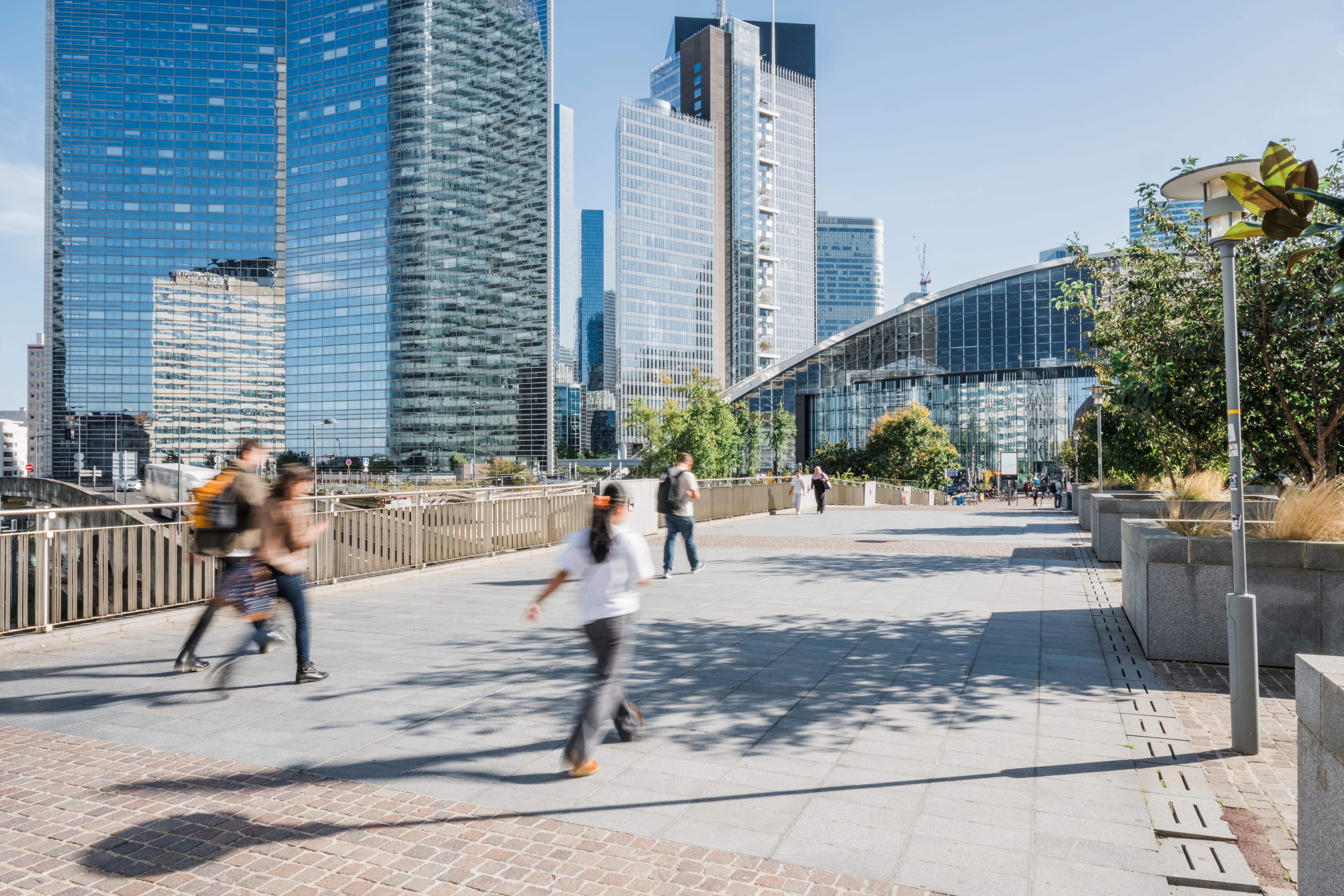 Blurred image of people walking in Financial district of Paris