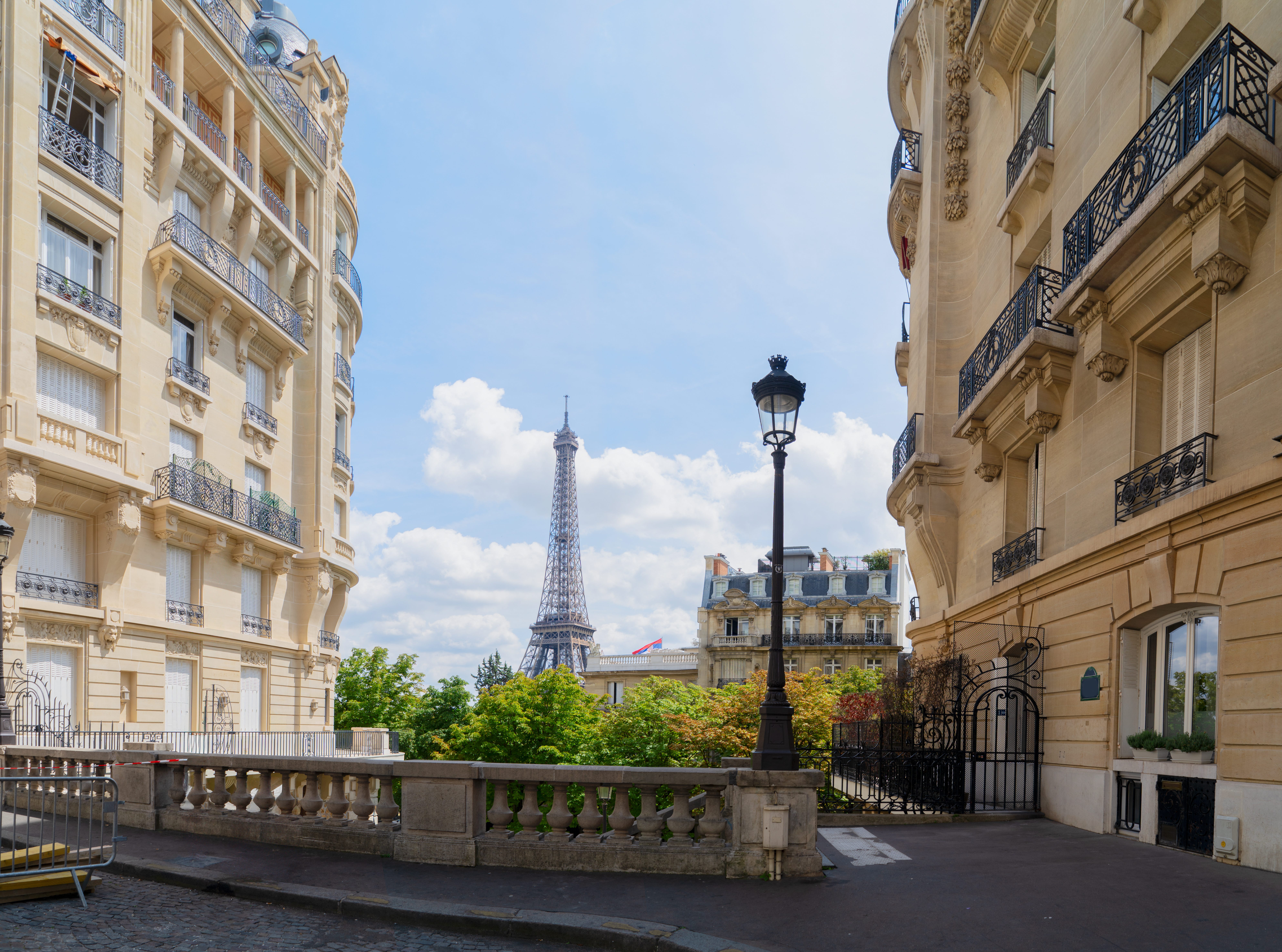 View of Paris street with eiffel tower in background