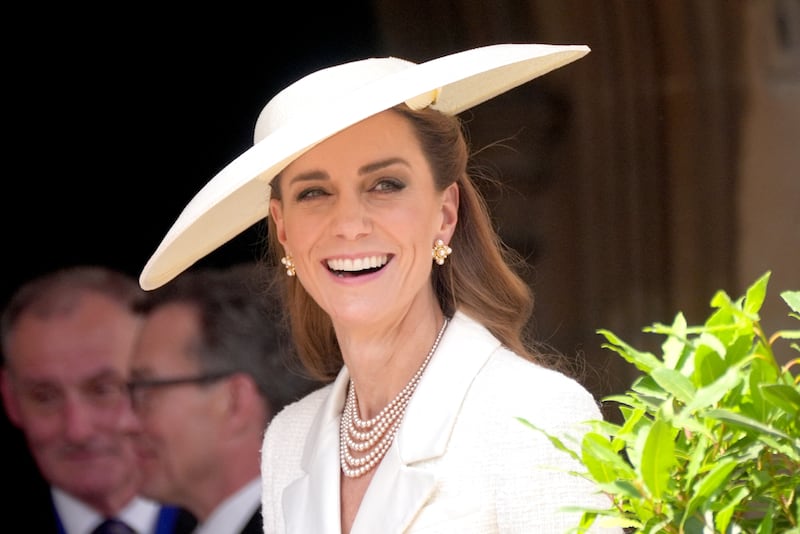 Kate Middleton smiles as she attends the Order of the Garter service at St George's Chapel in Windsor Castle.