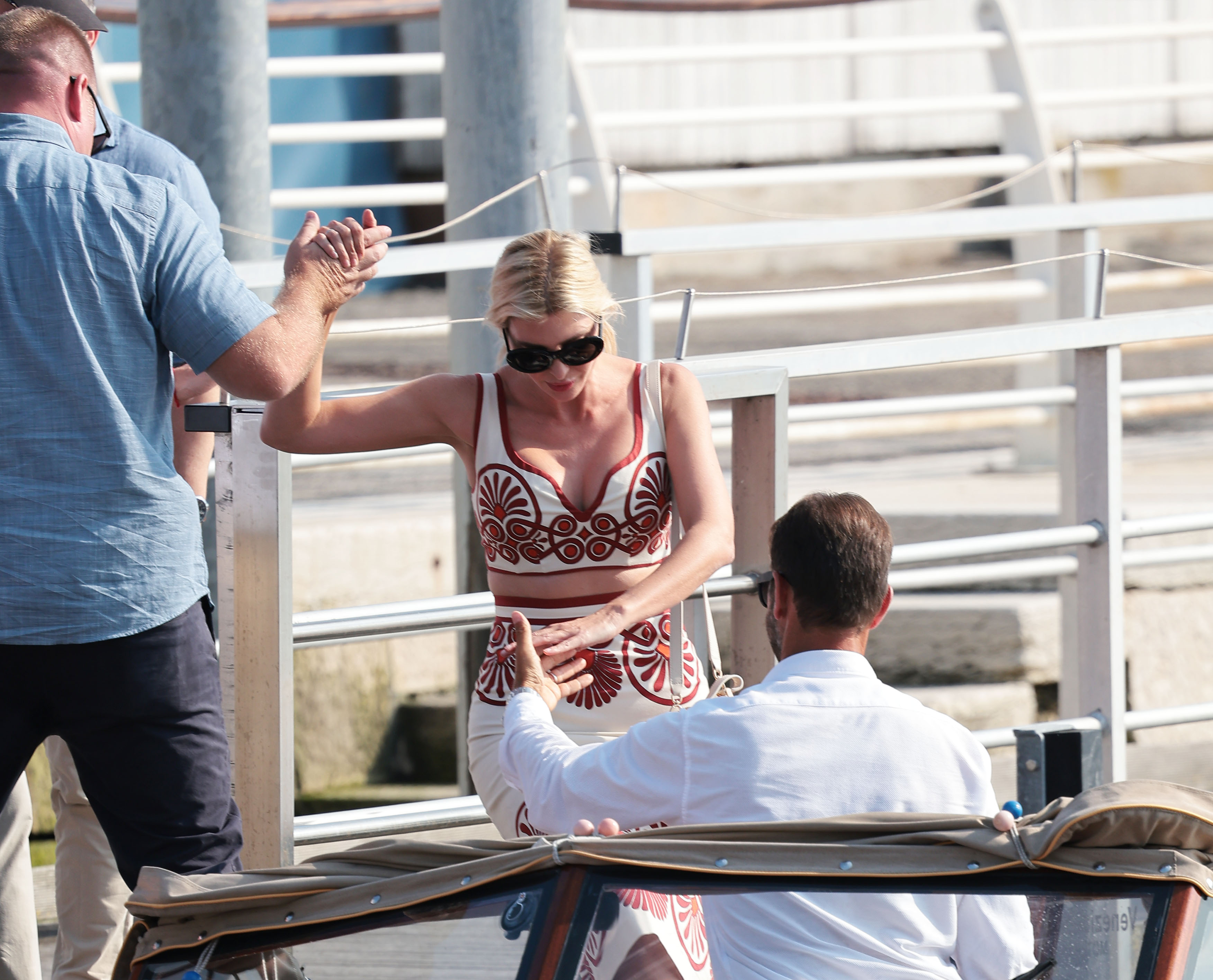 Ivanka Trump is helped onto a boat. 