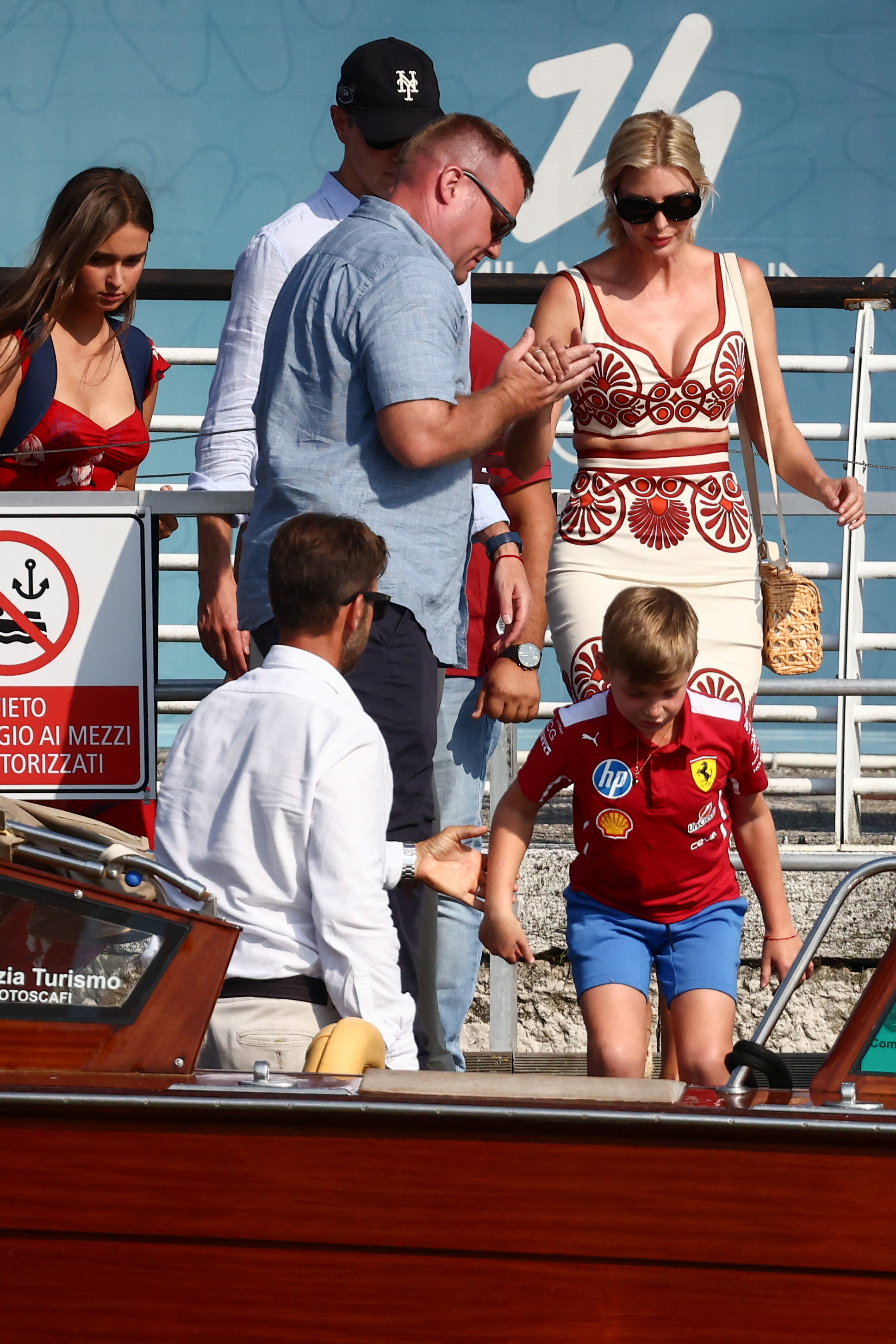 Ivanka Trump is helped into a boat. 