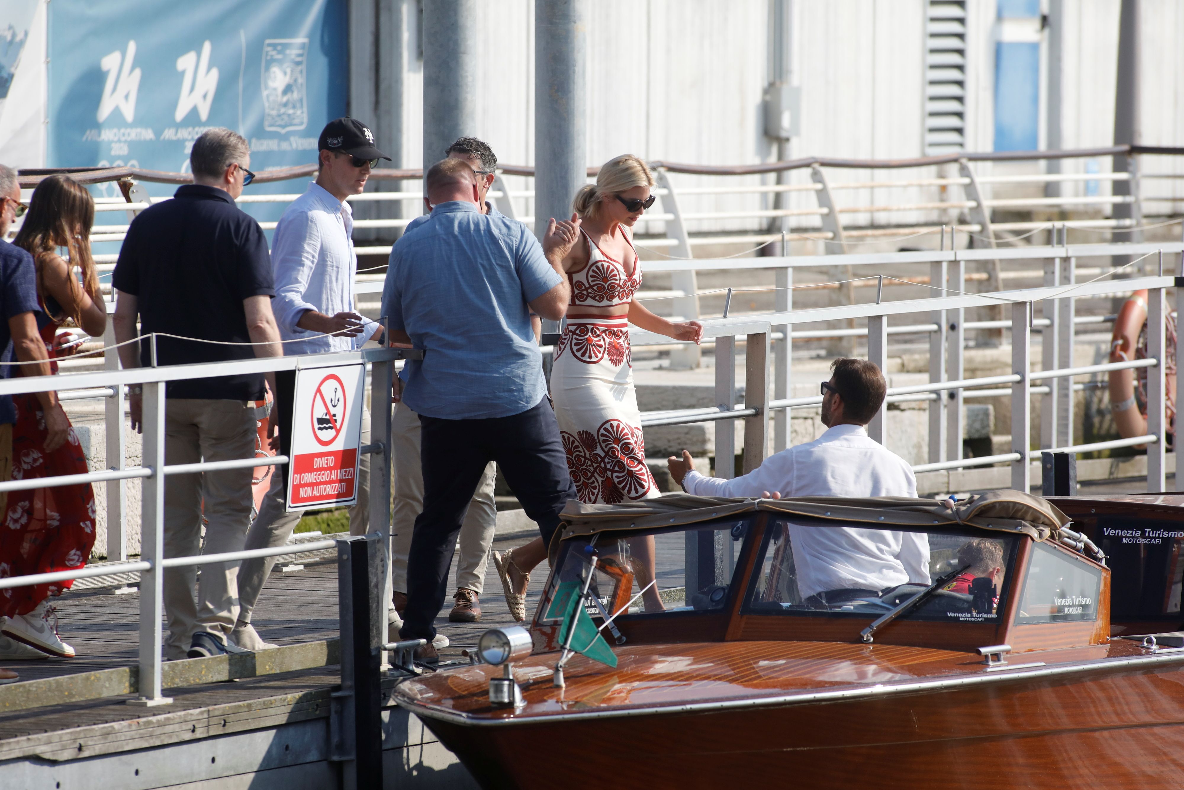 Jared Kushner waits for Ivanka Trump to get on a boat. 