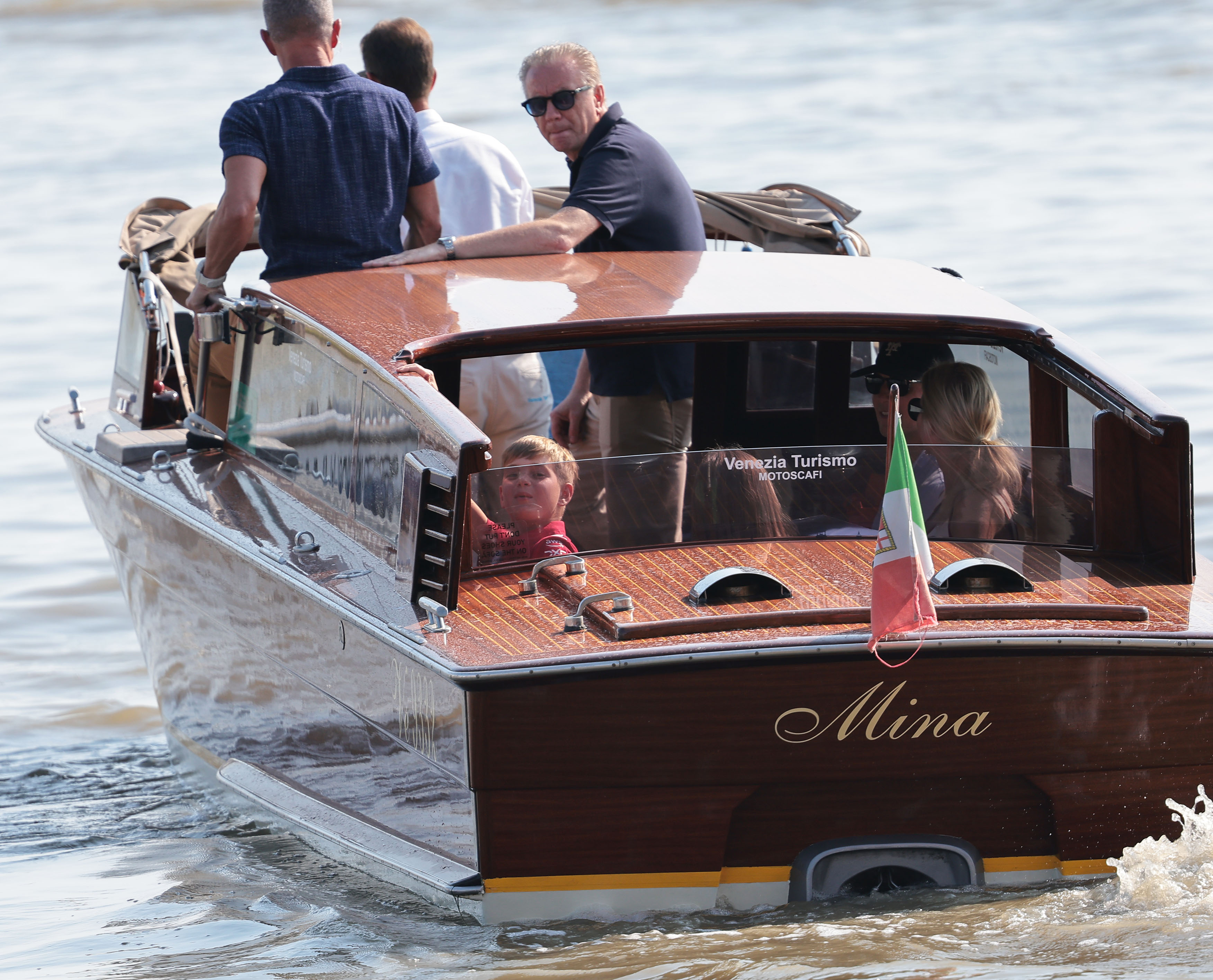 Jared Kushner and Ivanka Trump and children on a boat in Venice. 