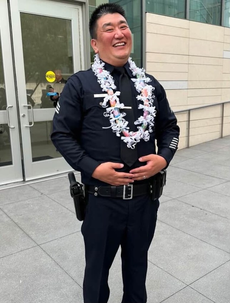Sergeant Shiou Deng, LAPD, wearing uniform and lei.