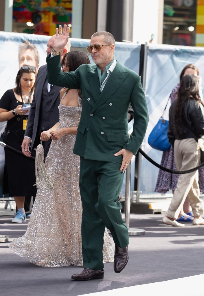  Ines De Ramon and Brad Pitt walk the red carpet together.