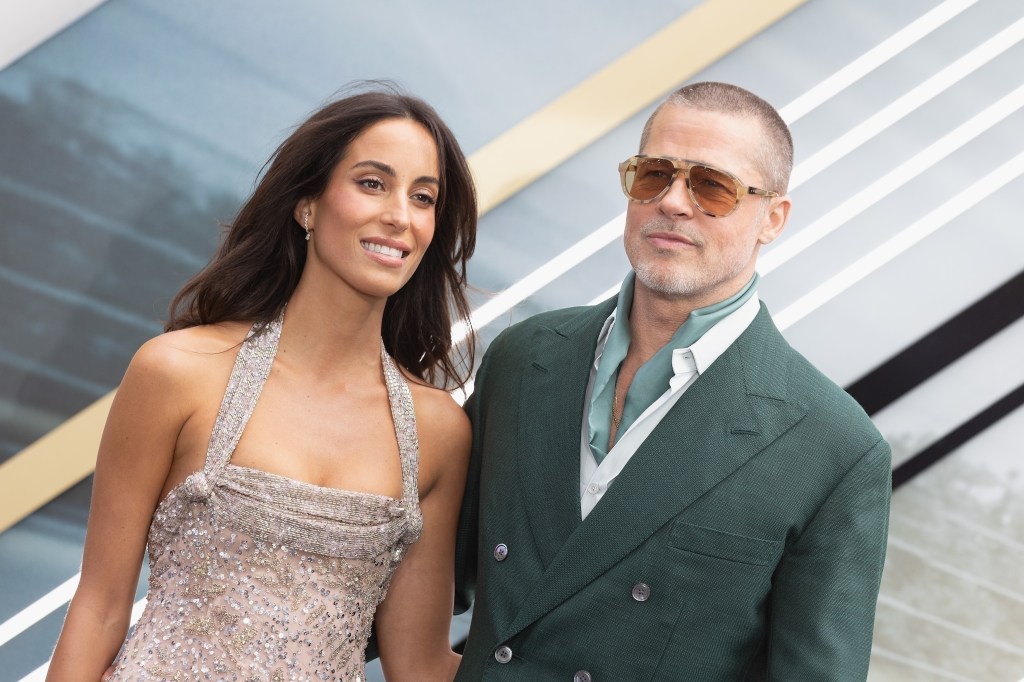 Ines De Ramon and Brad Pitt pose together.