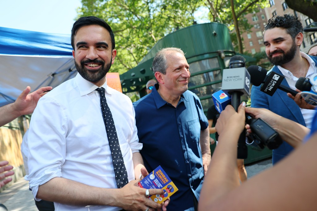 New York mayoral candidate, State Rep. Zohran Mamdani (D-NY) and NYC Comptroller and Mayoral Candidate Brad Lander speak with members of the press as they greet voters on Broadway on June 24, 2025 in New York City. 