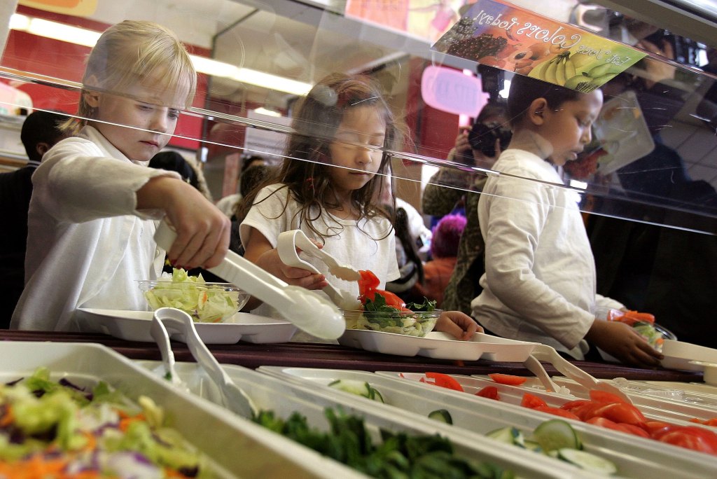 Students at Nettelhorst Elementary School grab food from a salad bar on March 20, 2006.