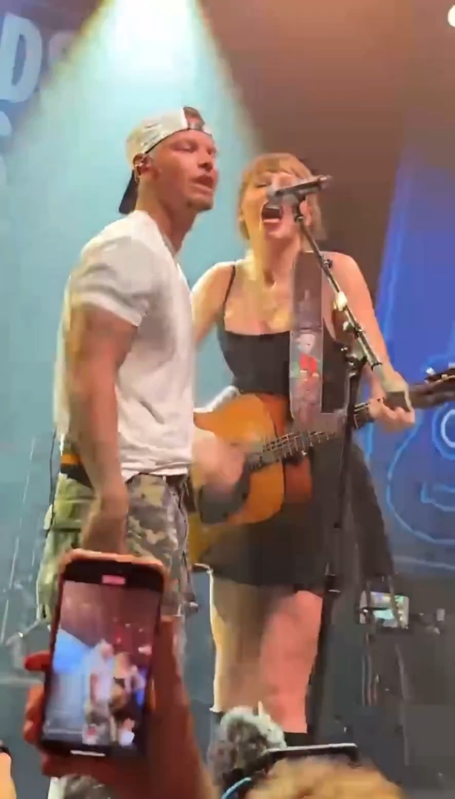 Taylor Swift performing live at Tight Ends and Friends in Nashville.