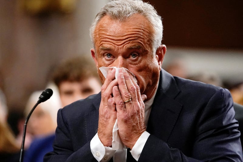 Robert F. Kennedy Jr., Trump's nominee to be Secretary of Health and Human Services, uses a tissue, as he testifies before a Senate Finance Committee confirmation hearing on Capitol Hill in Washington, DC on January 29, 2025.
