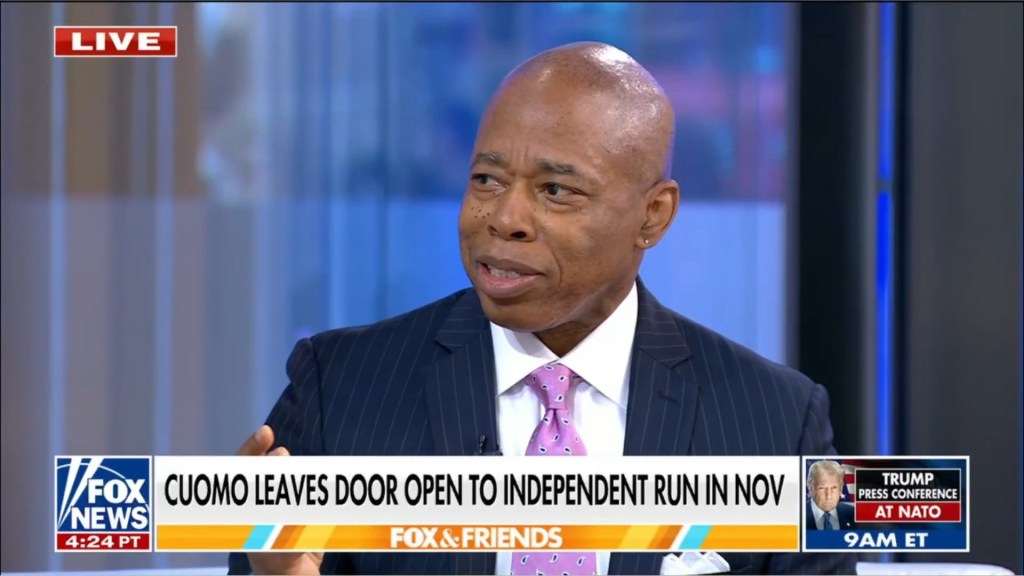 Man in suit speaking on Fox & Friends.