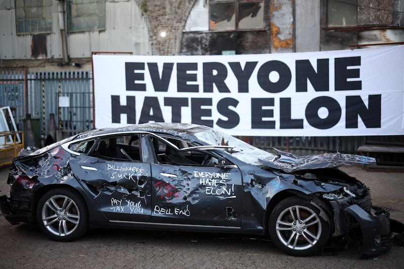 A Tesla car is pictured after being smashed-up at an anti Elon Musk protest, in south London on April 10, 2025.