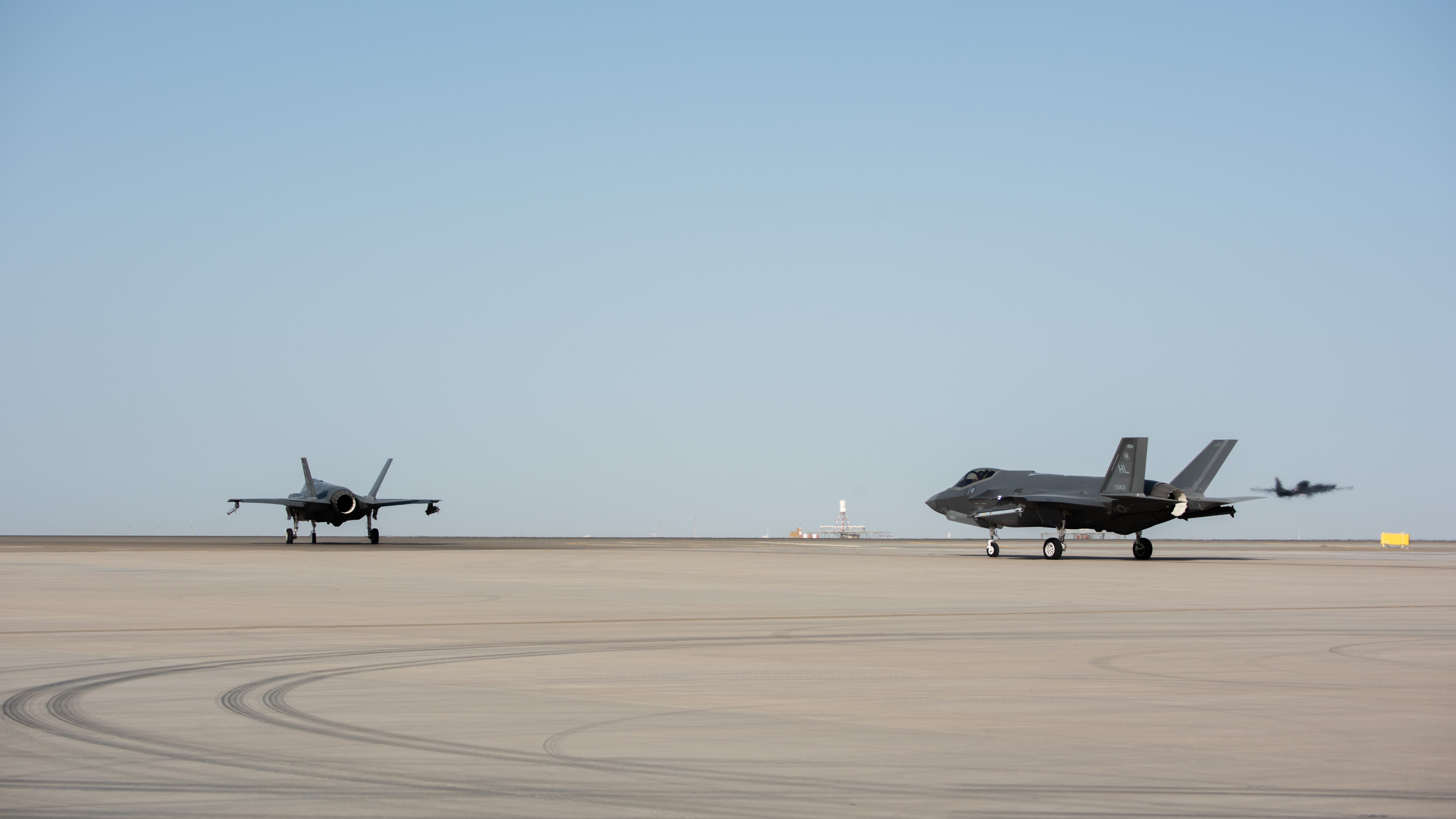 Two F-35s taxi before takeoff April 26, 2019, at Al Dhafra Air Base, United Arab Emirates.