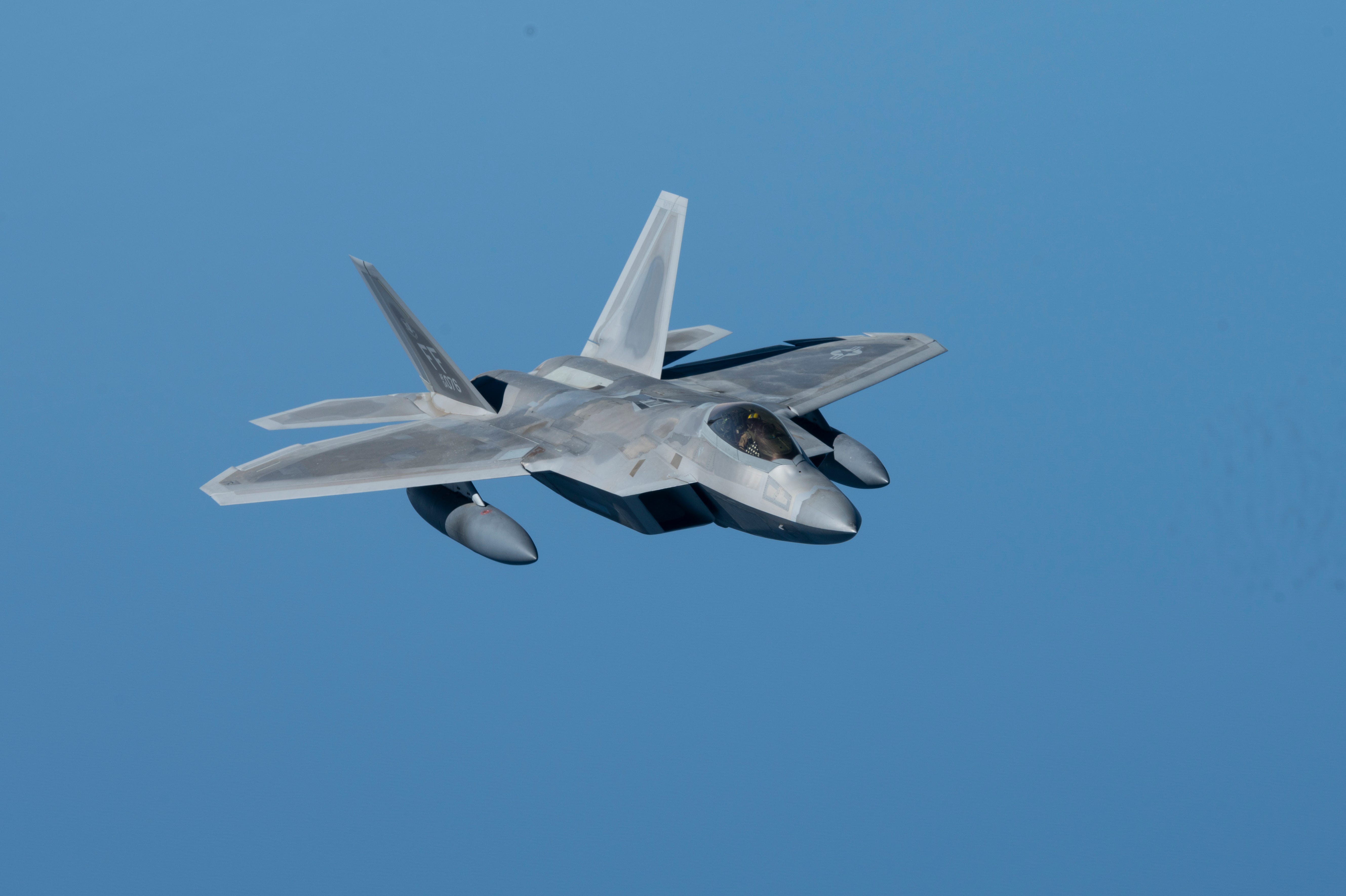 A US Air Force F-22 Raptor flies above the Arabian Gulf, March 29, 2022.