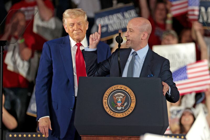 White House deputy chief of staff for policy and US homeland security advisor Stephen Miller (R) speaks as US President Donald Trump delivers his 100th Day in office achievement speech at Macomb County Community College Sports Expo Center in Warren, Michigan, on April 29, 2025. (Photo by JEFF KOWALSKY / AFP) (Photo by JEFF KOWALSKY/AFP via Getty Images)