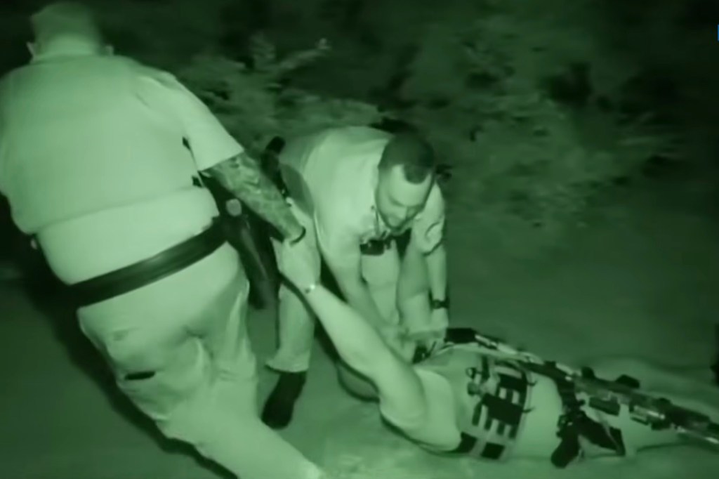 Sheriff's deputy injured and on the ground receiving medical attention.