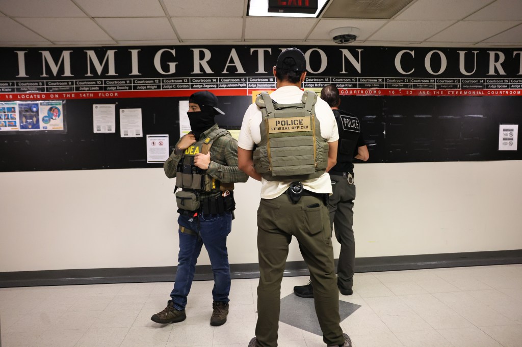 Federal agents patrol the halls of immigration court at the Jacob K. Javitz Federal Building on June 9, 2025.