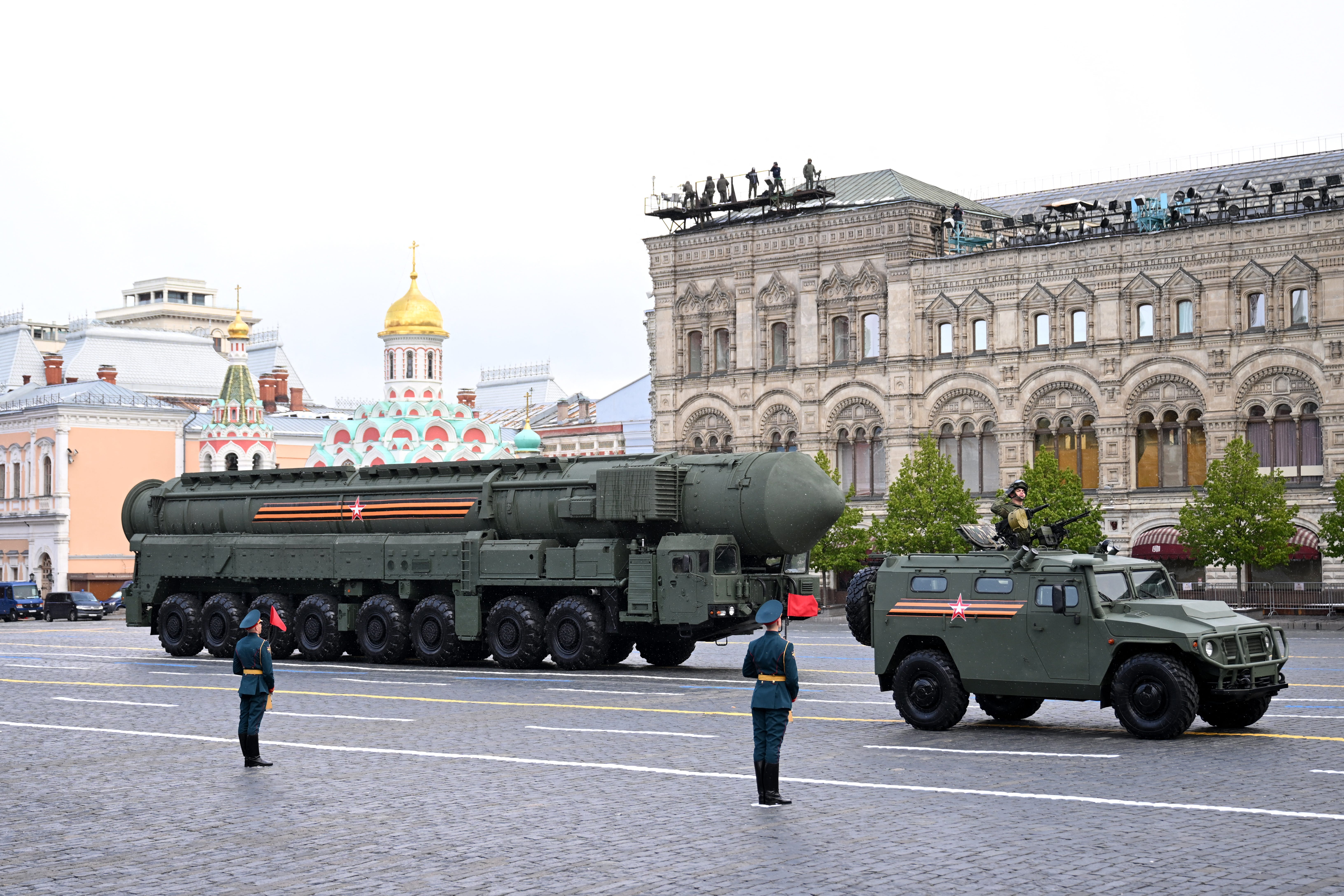 A Russian all-terrain infantry mobility vehicle (ATV) drives ahead of an intercontinental ballistic missile system on Moscow's Red Square during a Victory Day military parade.
