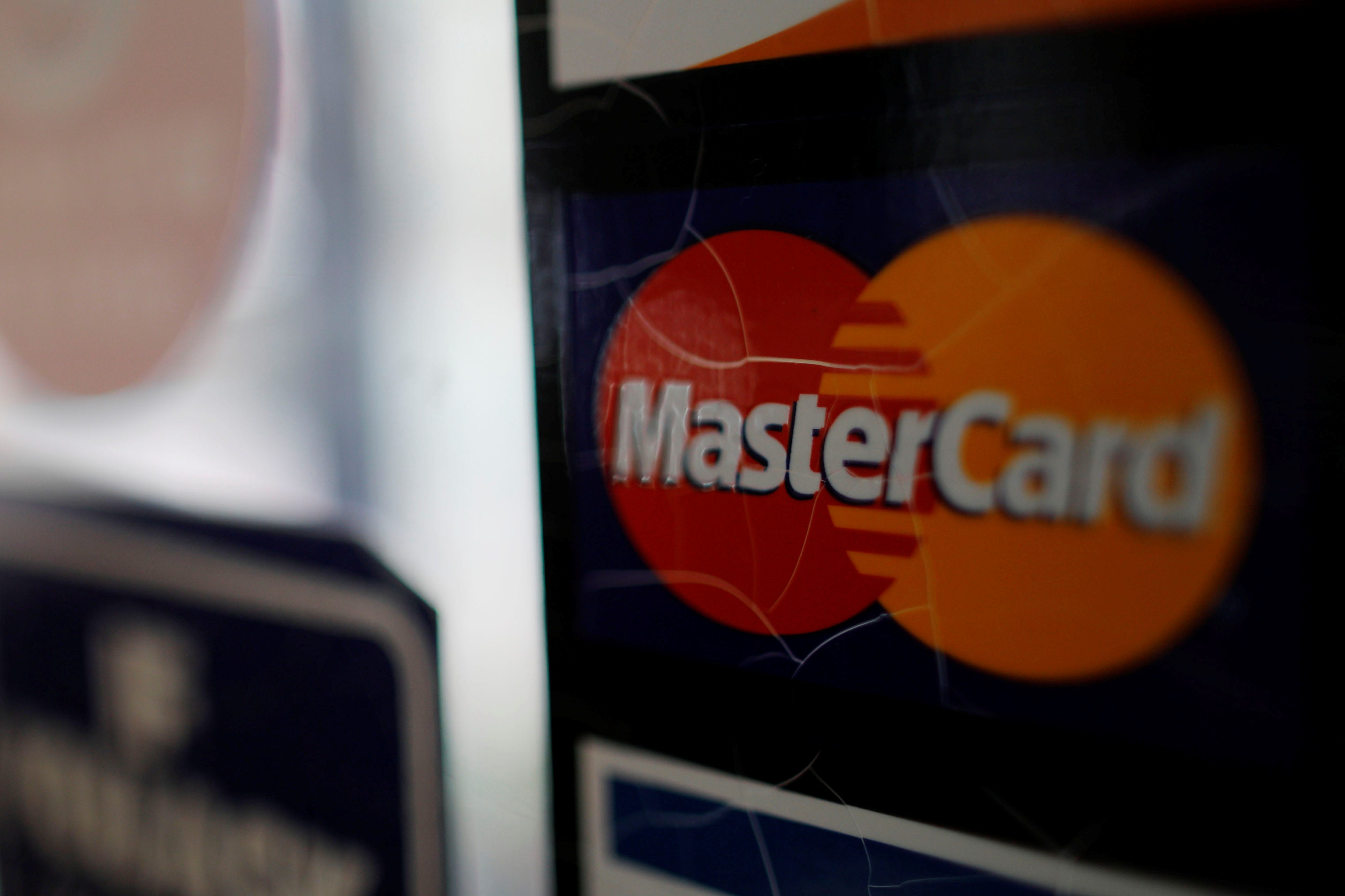 FILE PHOTO: A sticker shows that a store accepts MasterCard in Harvard Square in Cambridge, Massachusetts, U.S., July 25, 2018. REUTERS/Brian Snyder