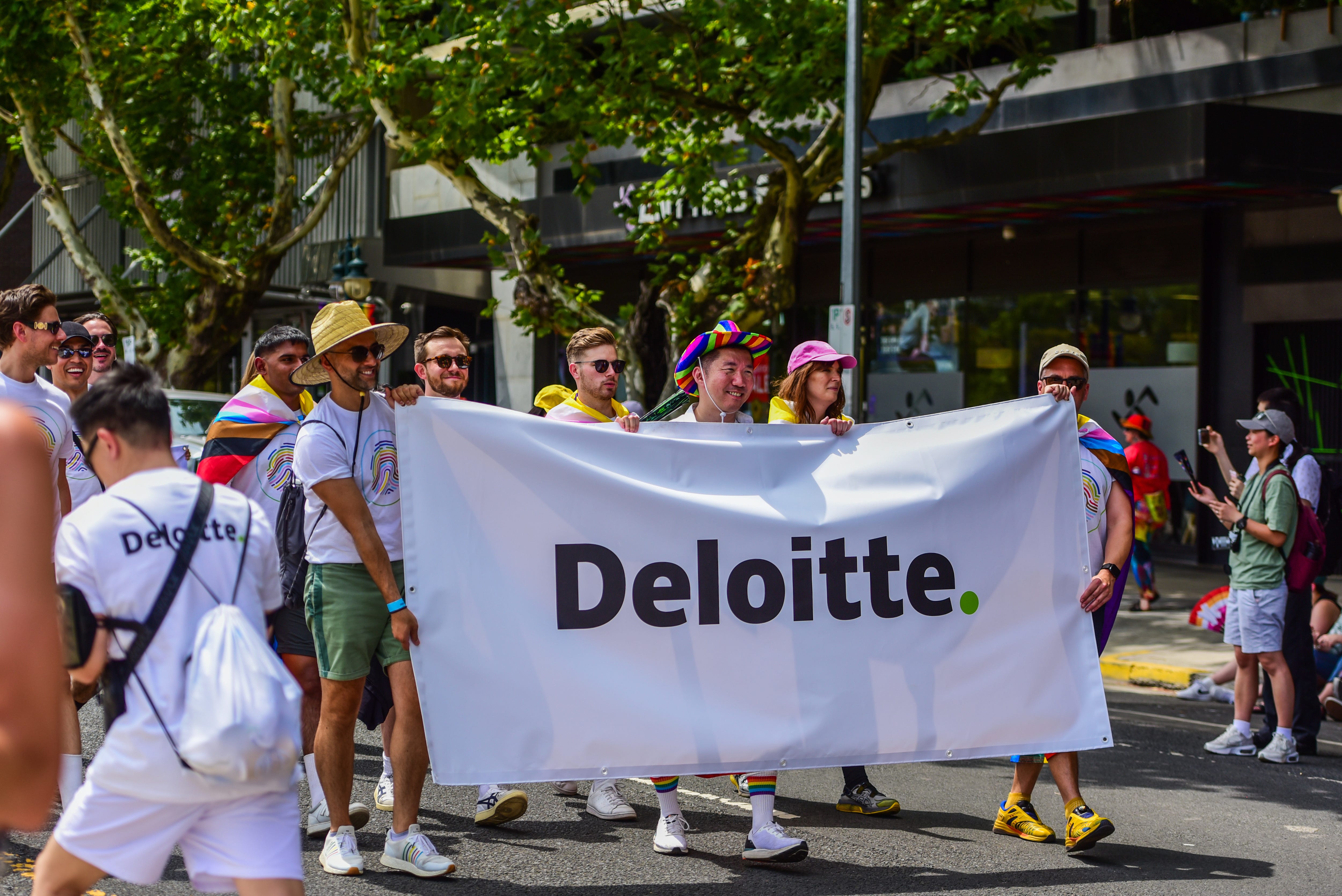 2025/02/02: Deloitte staff are seen marching in the Pride parade 2025, part of LGBTQ+ community's Midsumma Festival.