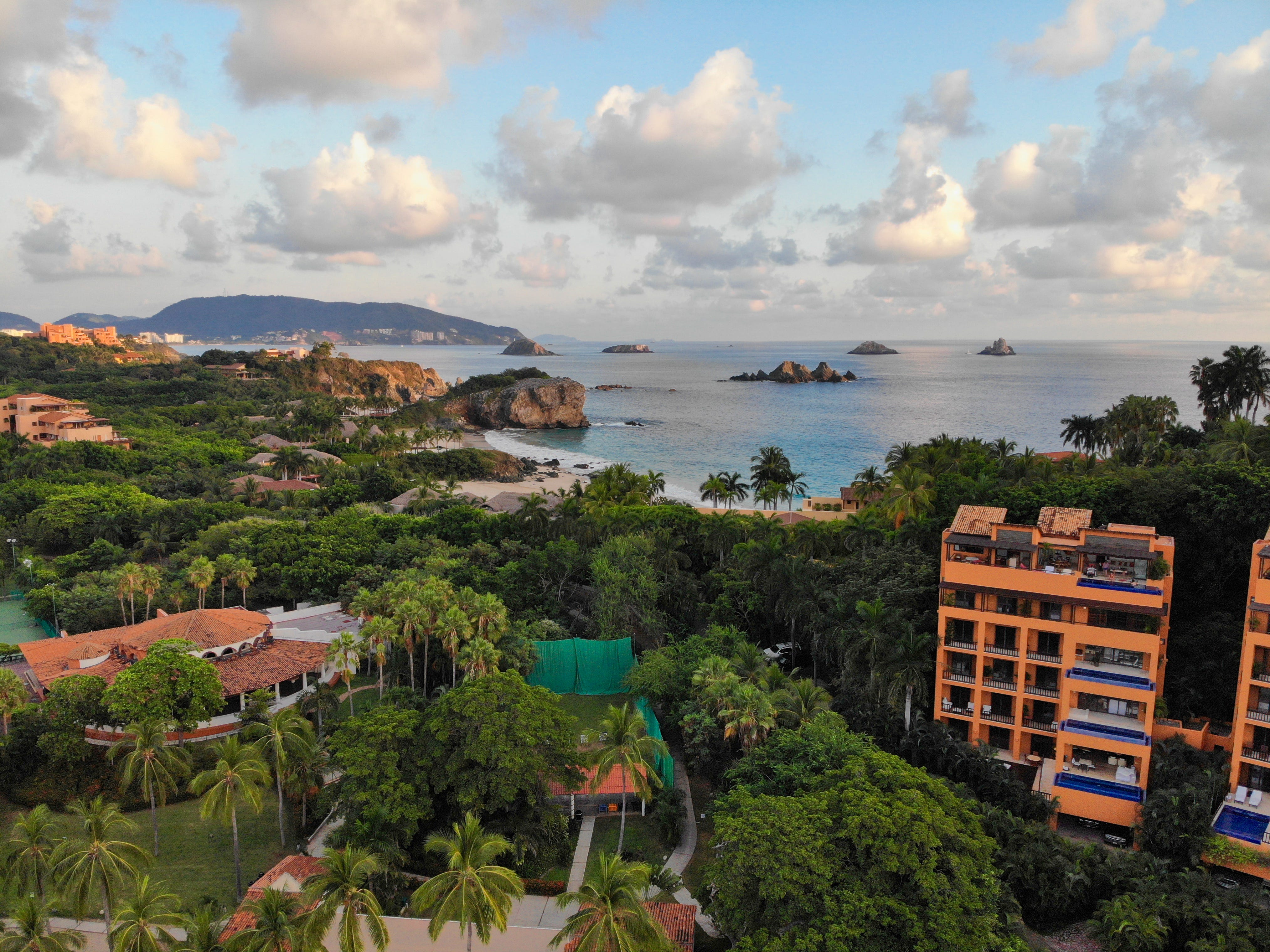 An aerial view of Zihuatanejo, Guerrero, Mexico, complete with buildings, trees, and the ocean.