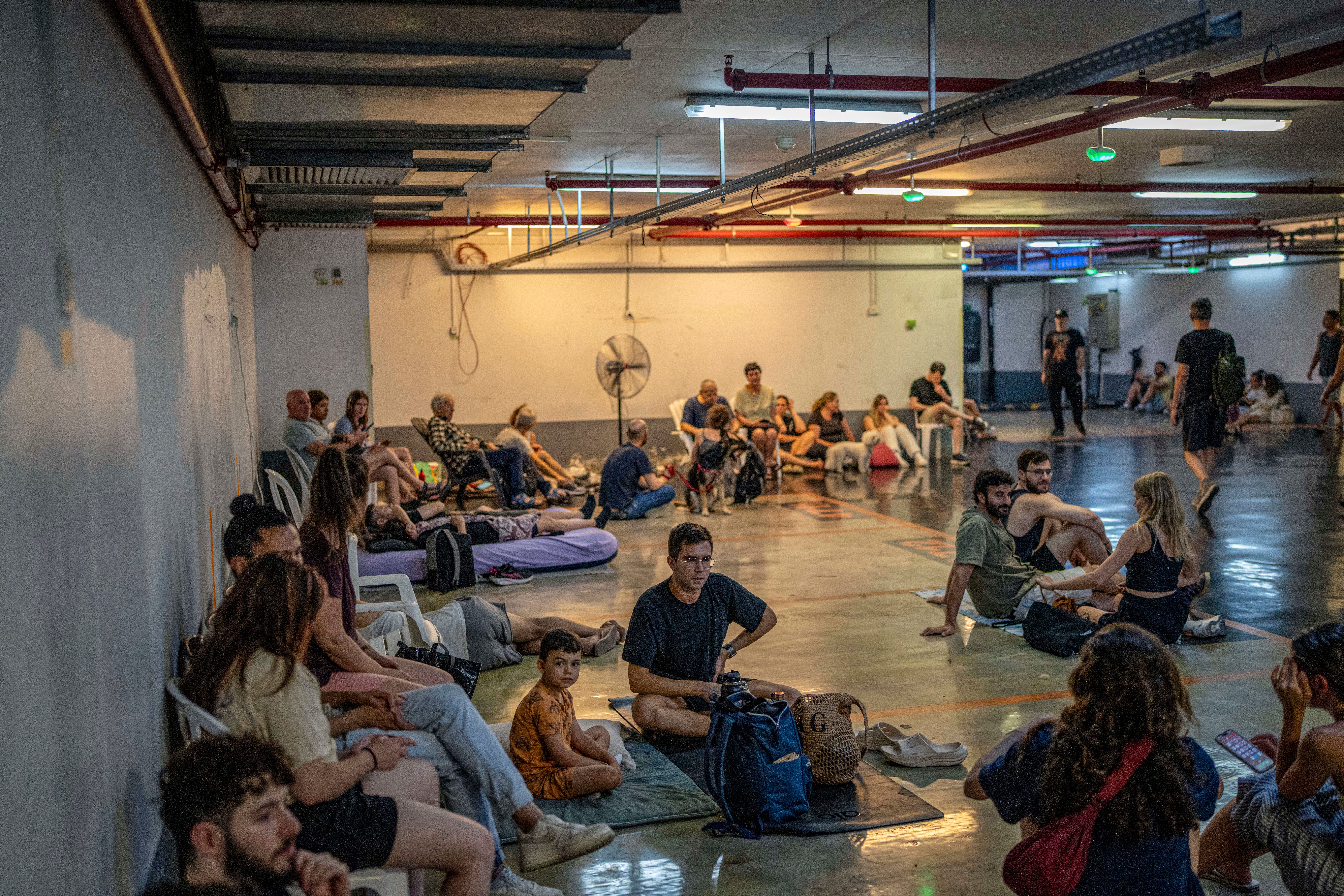 Israelis take shelter in an underground station.