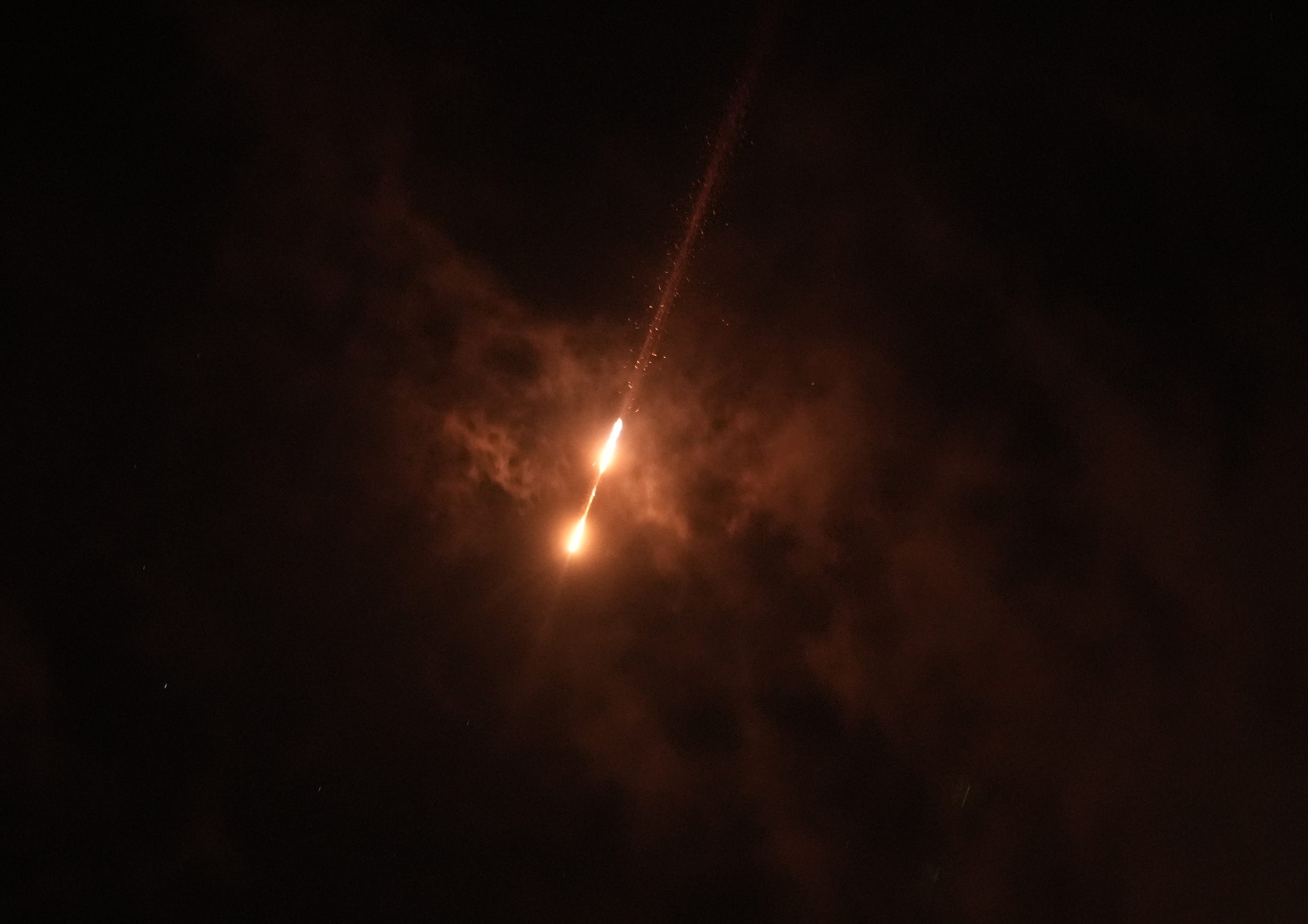 Missiles fired from Iran are seen streaking across the skies over the city of Ramallah in the West Bank on June 19, 2025.