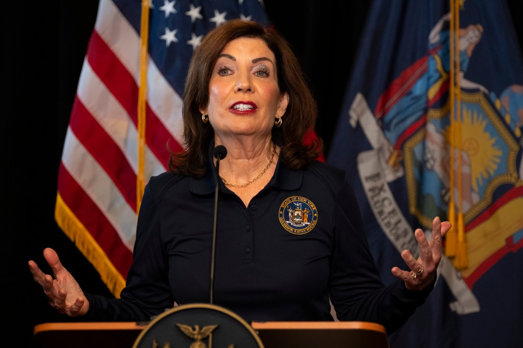 Governor Kathy Hochul speaking at a podium.