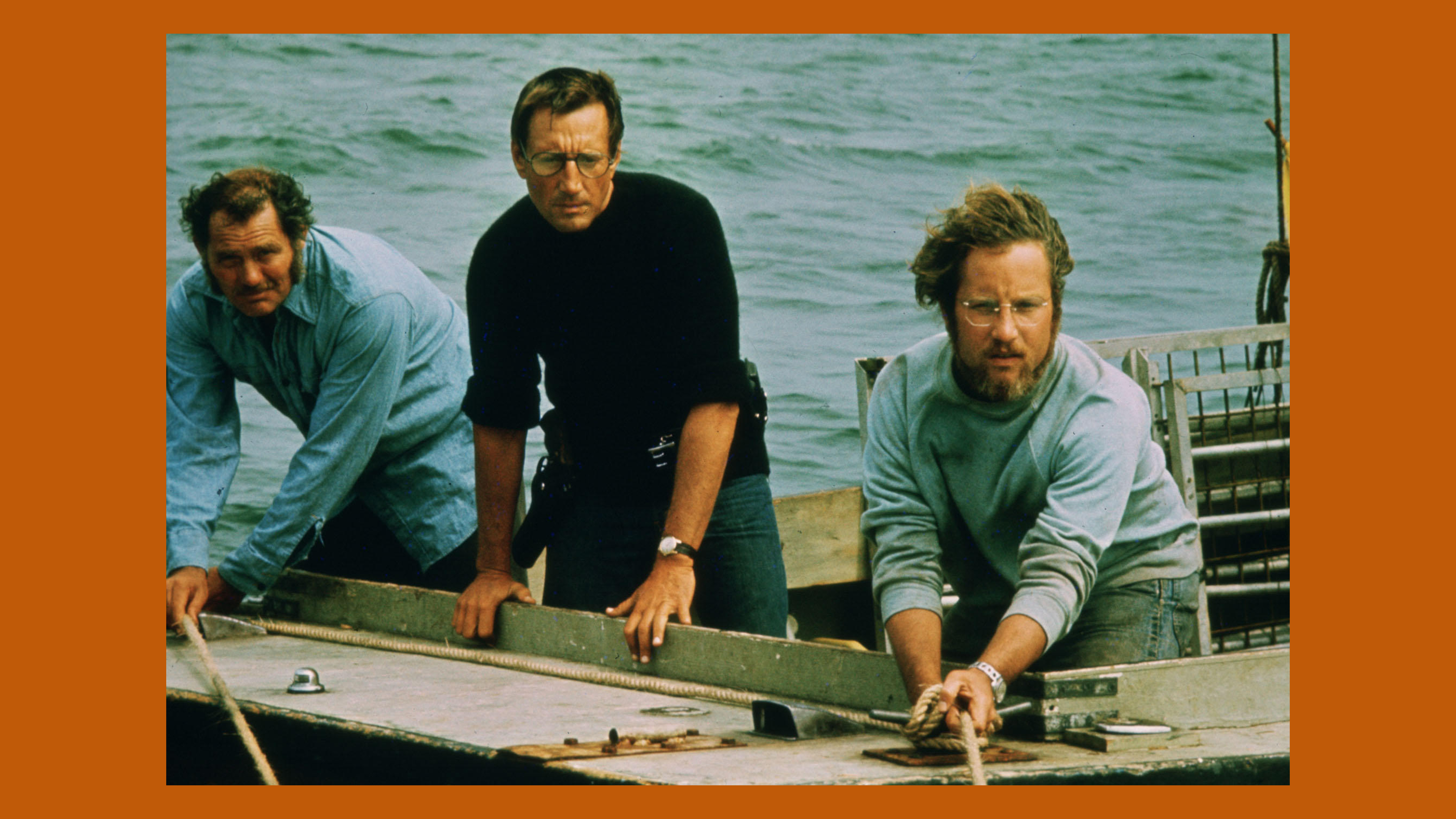 A film still of Robert Shaw, Roy Schneider, and Richard Dreyfuss in 