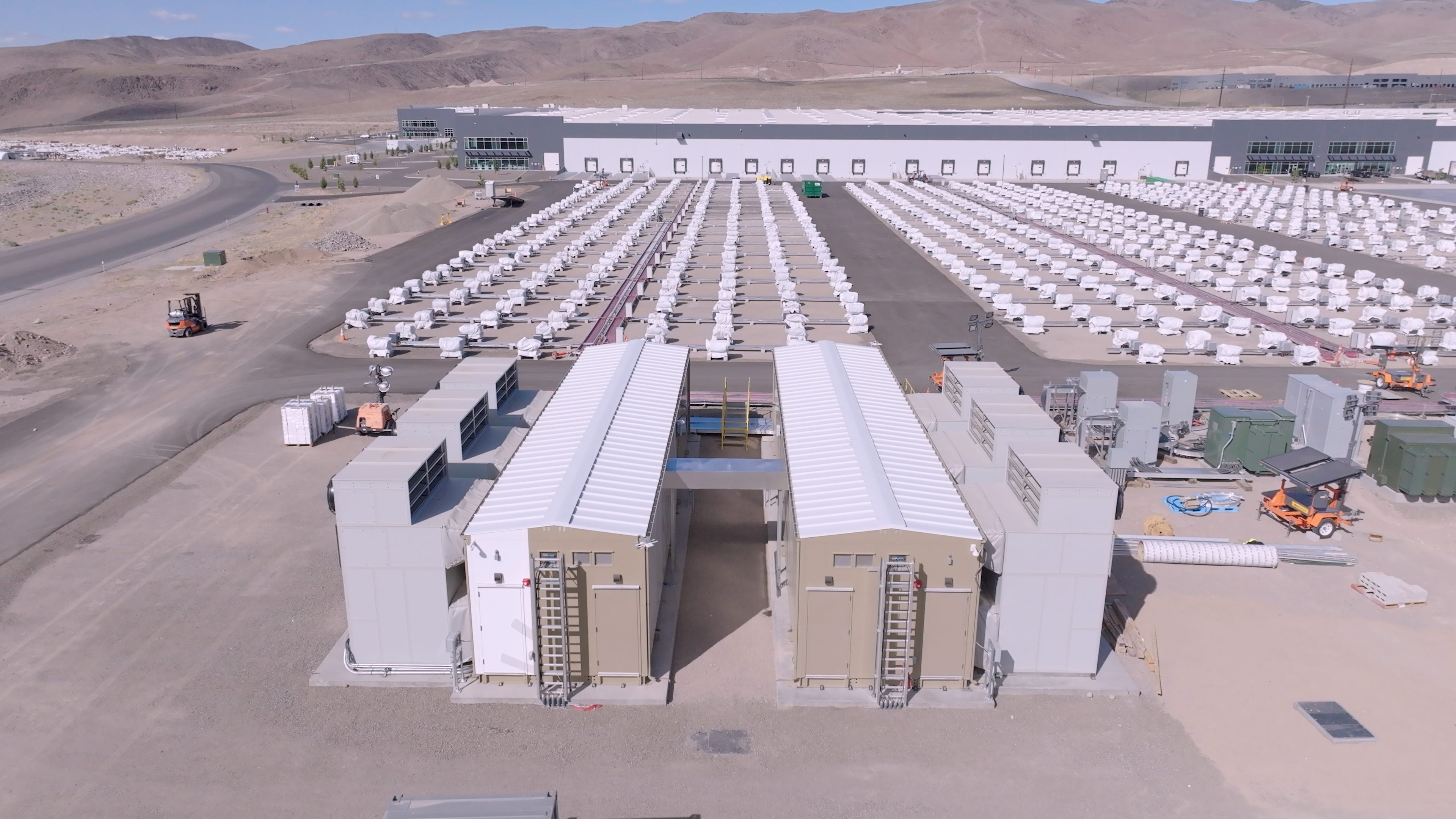 A modular data center on the Redwood Materials campus in Nevada, with supporting battery packs.