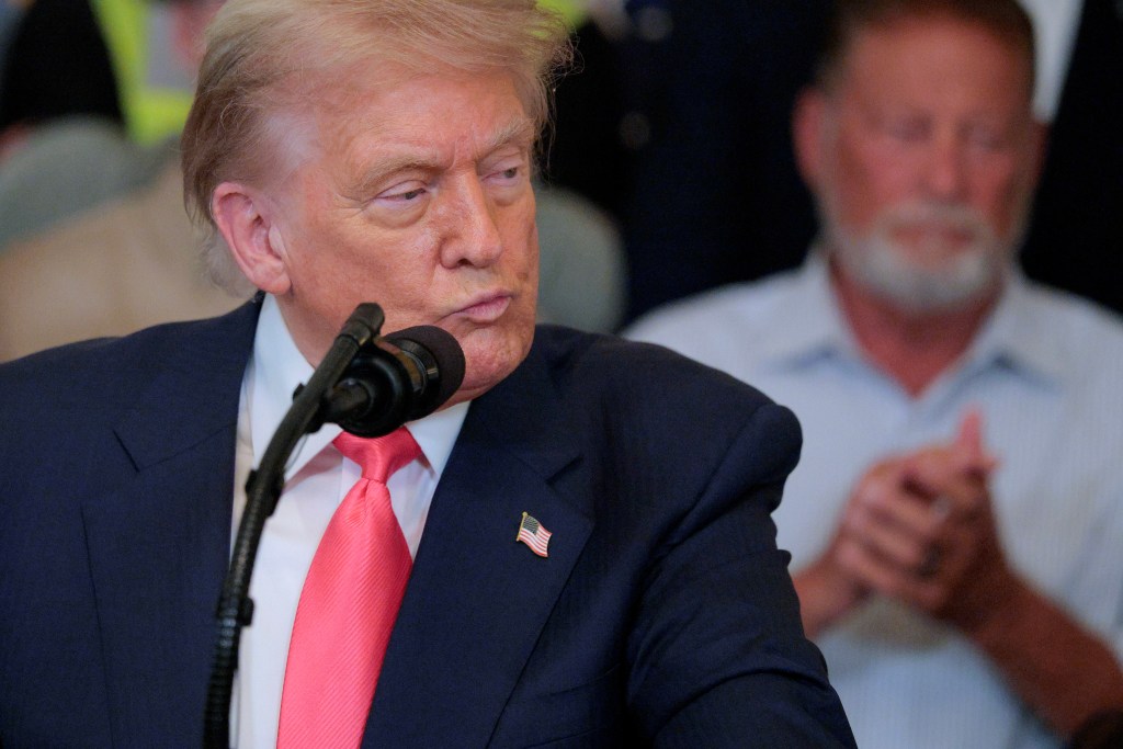 President Trump speaking at a podium.