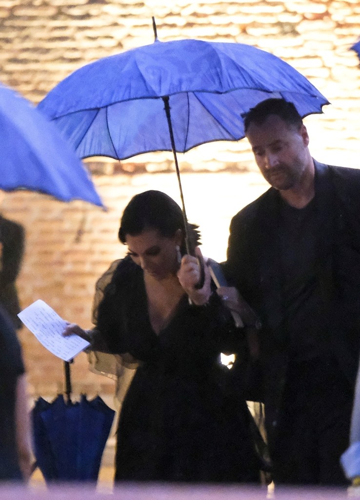 Kris Jenner and Corey Gamble are spotted leaving Jeff Bezos and Lauren Sánchez's pre-wedding party during a crazy rainstorm in Venice